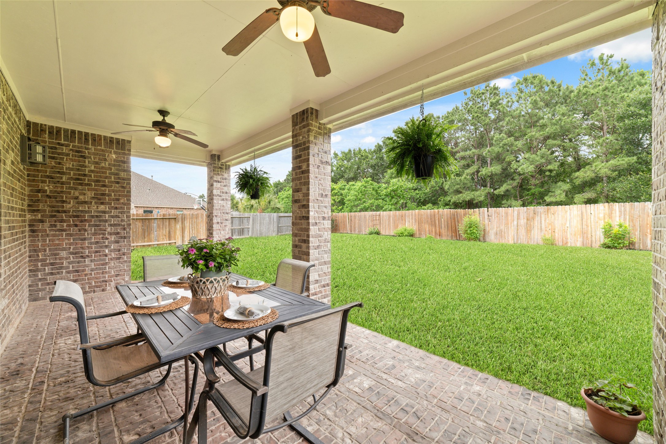 Large covered, brick patio - great for easy entertaining or a peaceful spot for your morning coffee