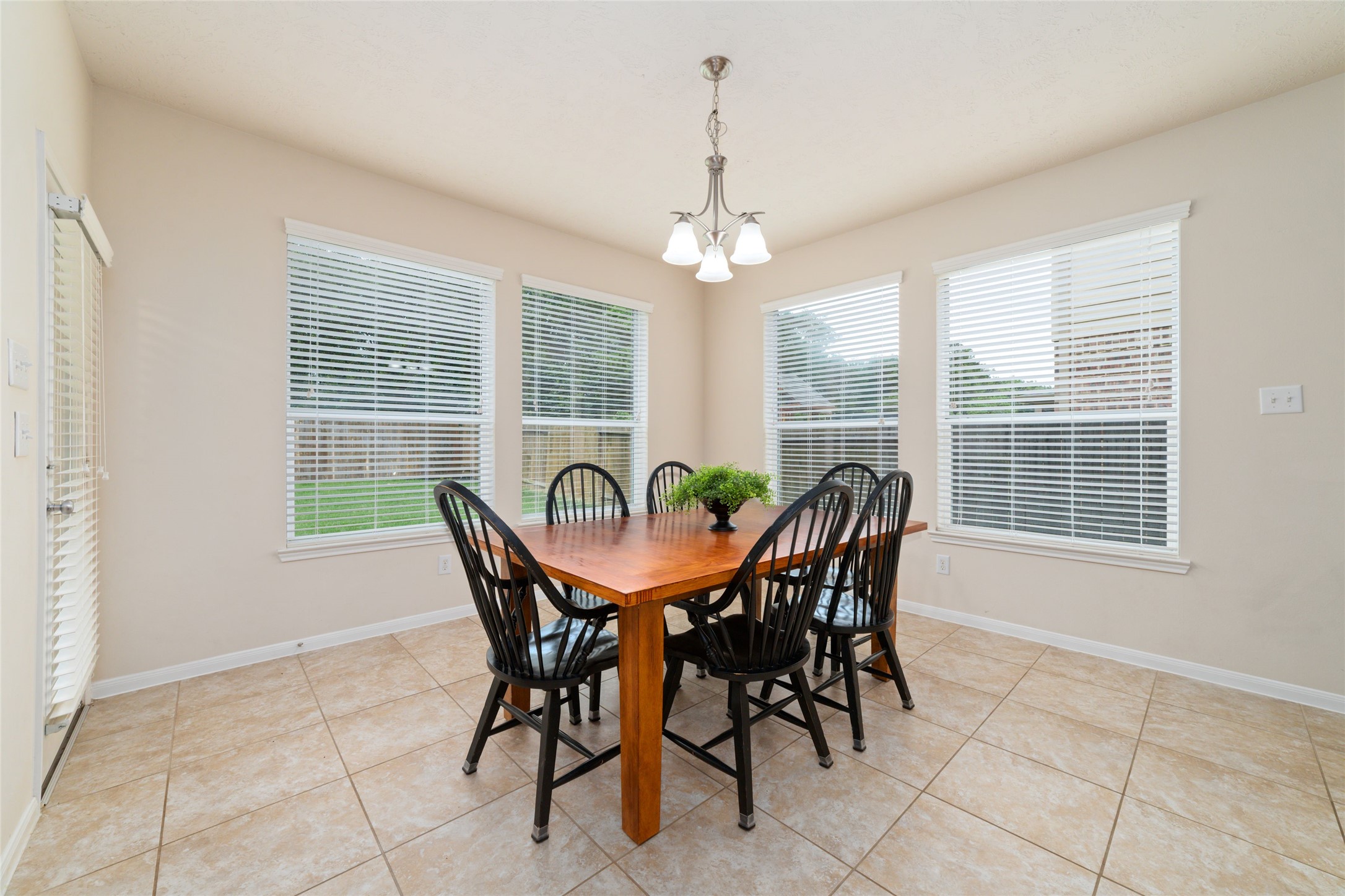 The large sunny breakfast room flows seamlessly into the living room for easy entertaining.