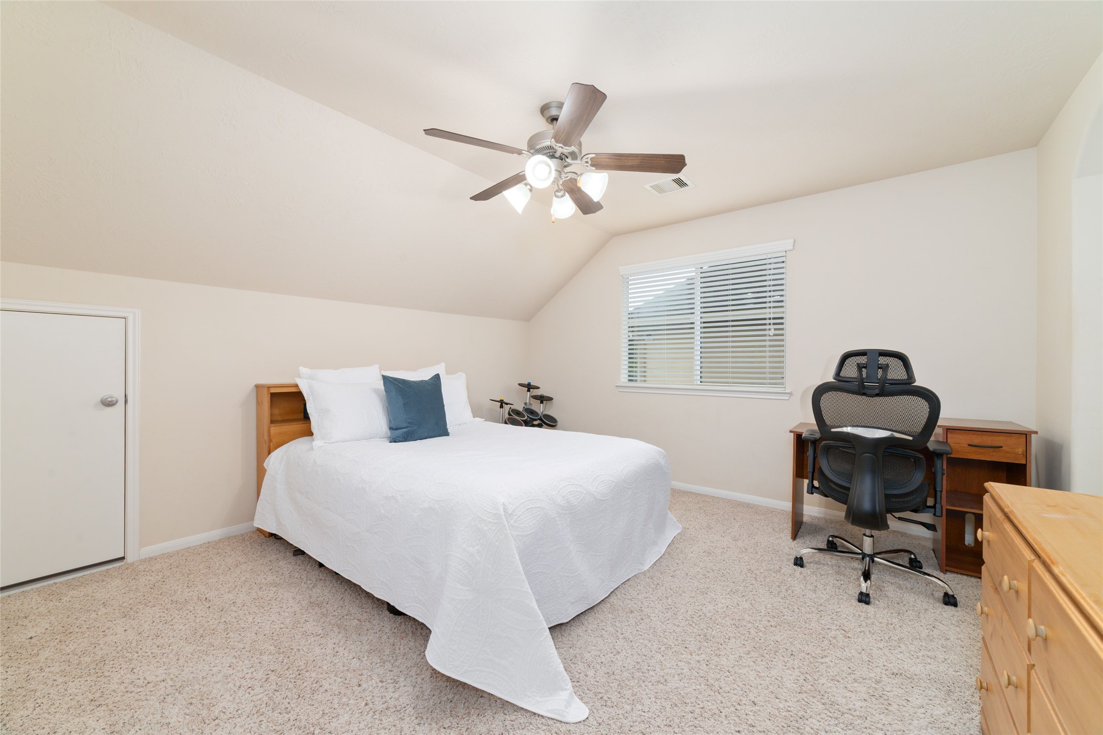 The first of four, spacious upstairs bedrooms share a hollywood style bathroom, each with their own vanity areas and each with their own walk-in closets.
