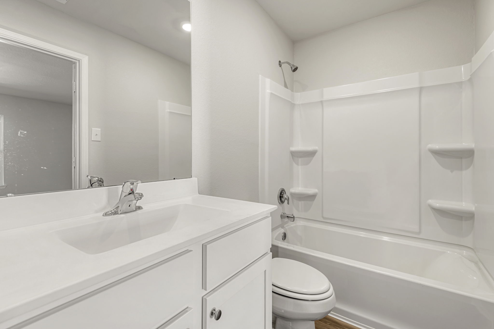 Adjacent primary bathroom with a walk-in closet!