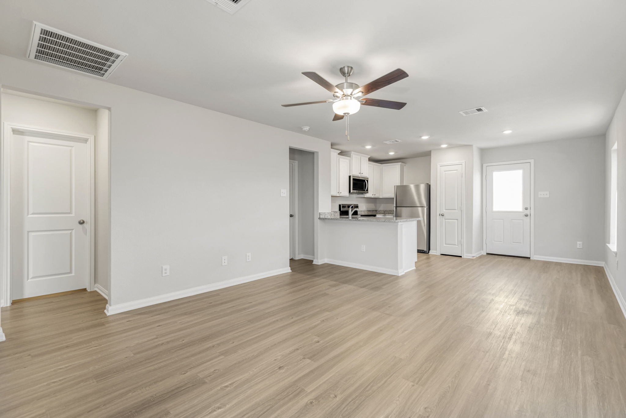 The living room has plenty of space to gather with your family and friends.