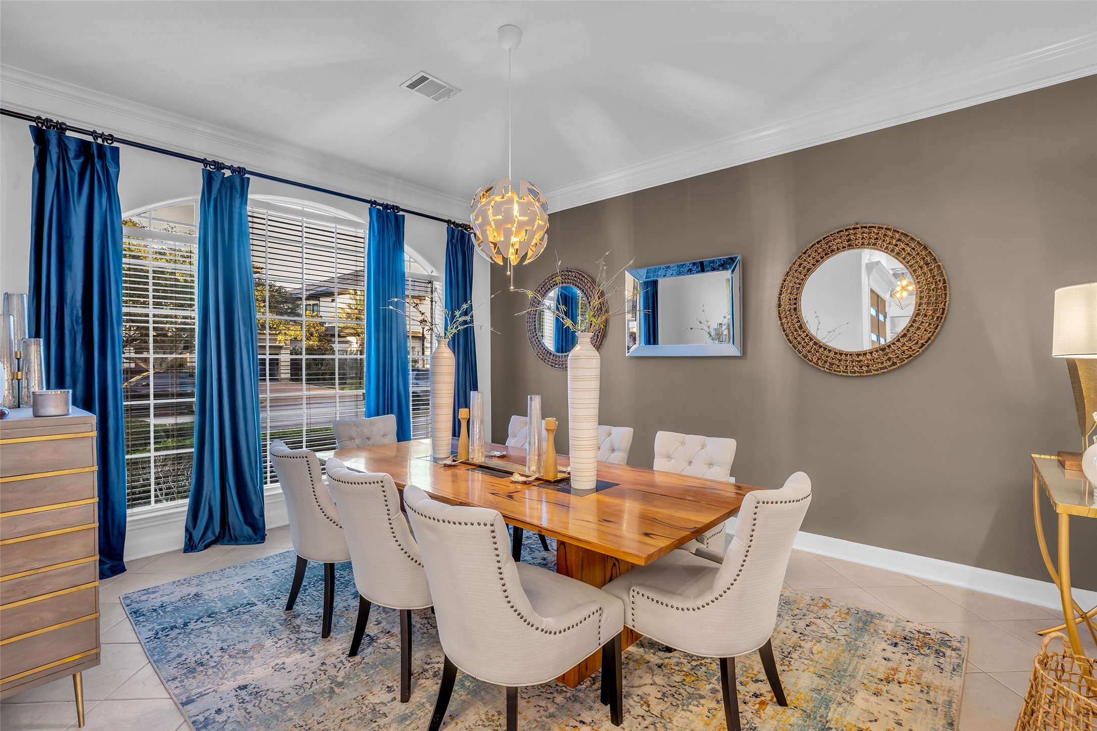 To the left of the entrance is the formal dining room. A dry bar area is also located near the dining room and kitchen.
