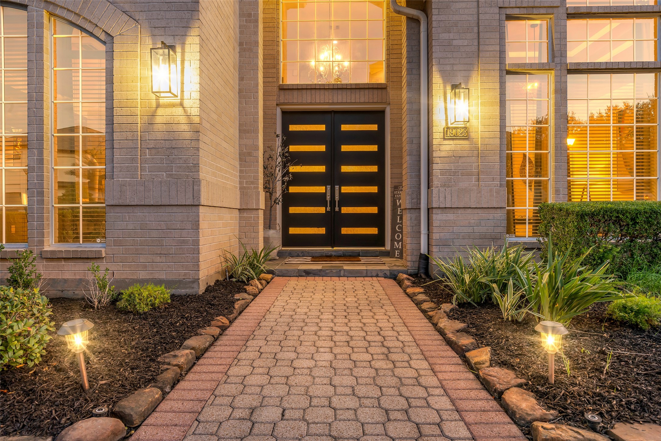 Inviting entrance with a contemporary front door.