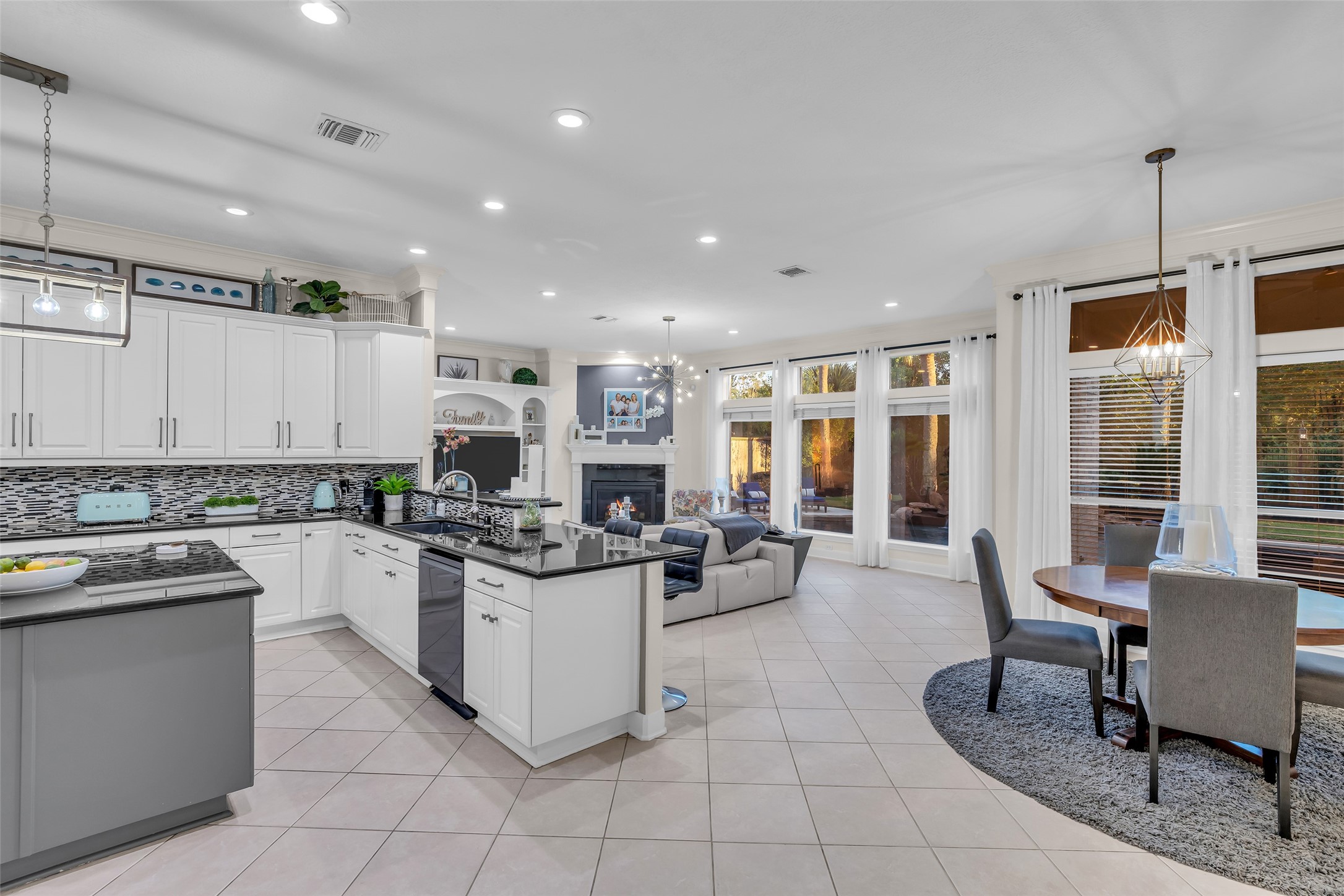 The living area is open to the breakfast area and kitchen.