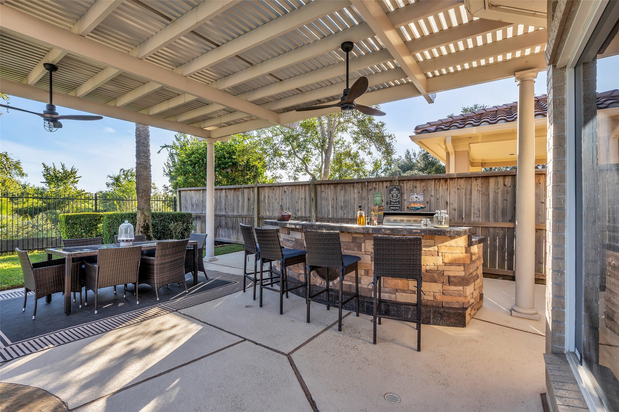 There is a built-in BBQ and fridge in the bar area. Perfect backyard for entertaining.