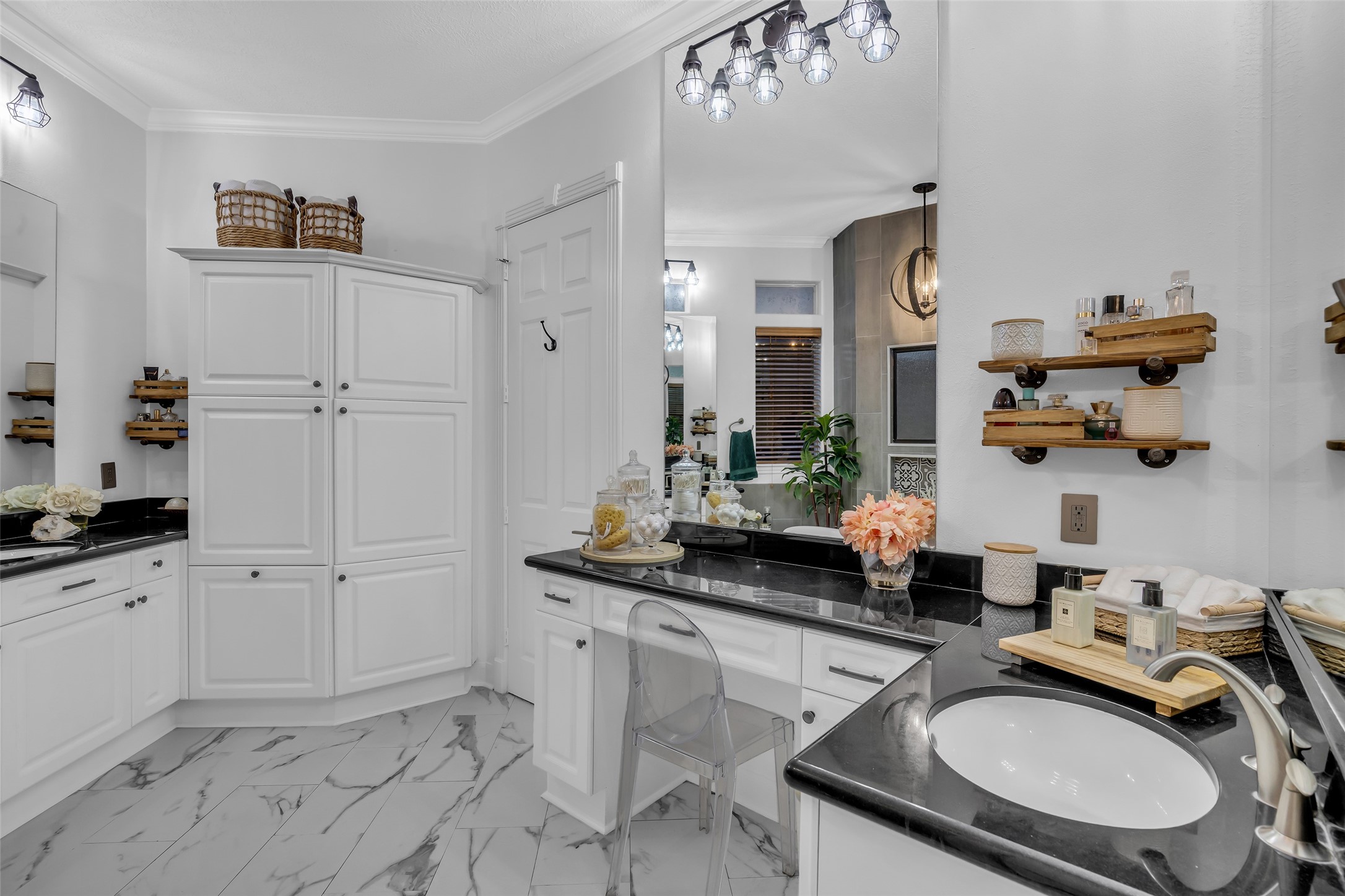 Double vanities and an abundance of storage in the primary bathroom.