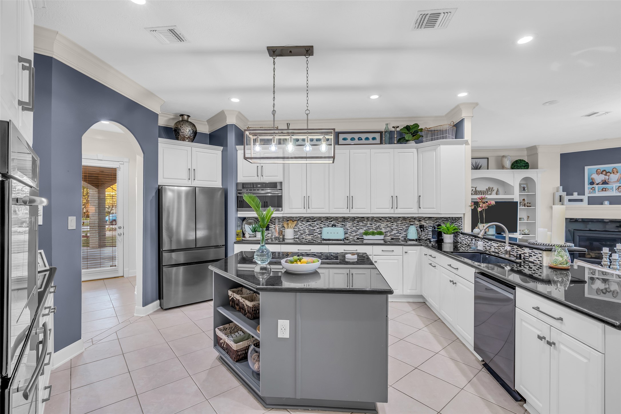 There is an abundance of storage in the kitchen, and there is a walk-in pantry through the archway.