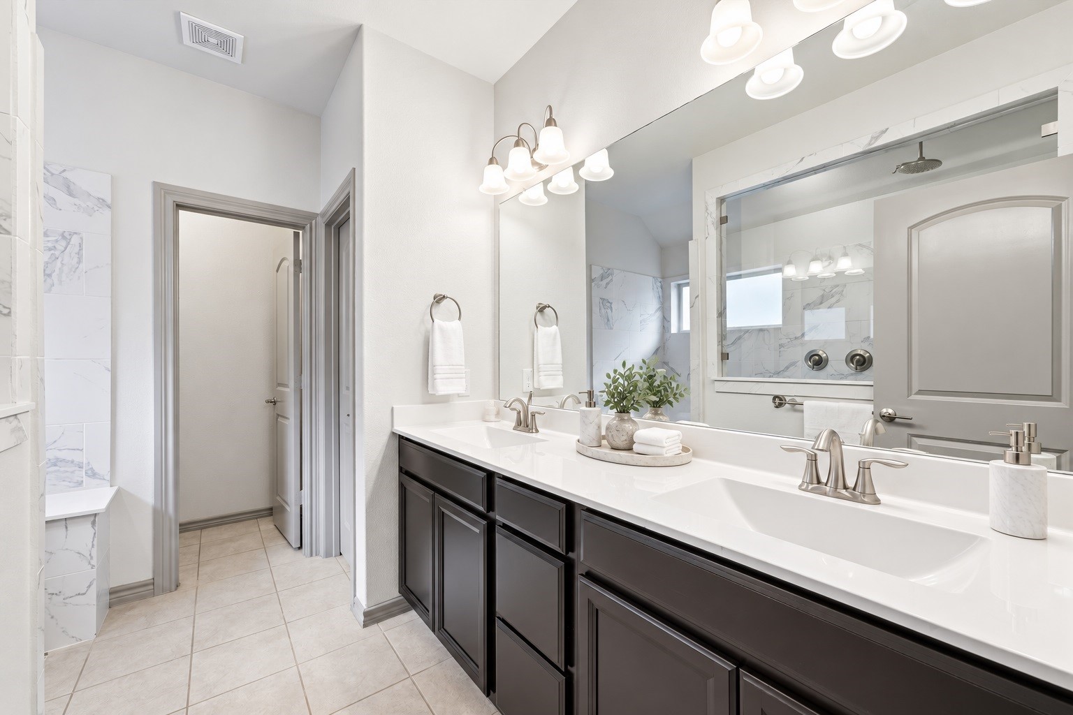 Virtually staged  Countertop accessories, towels, and plants were digitally added.