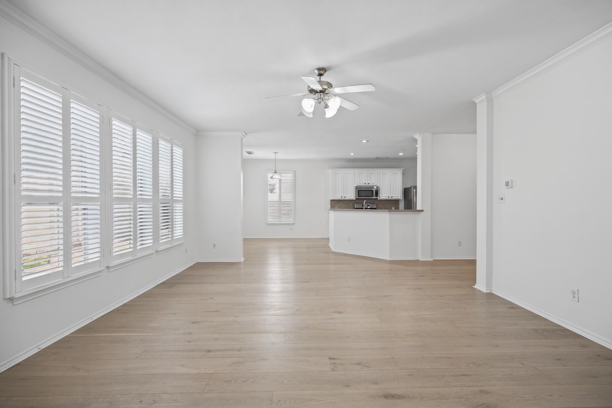 The reverse view highlights the easy flow between the living room and kitchen.
