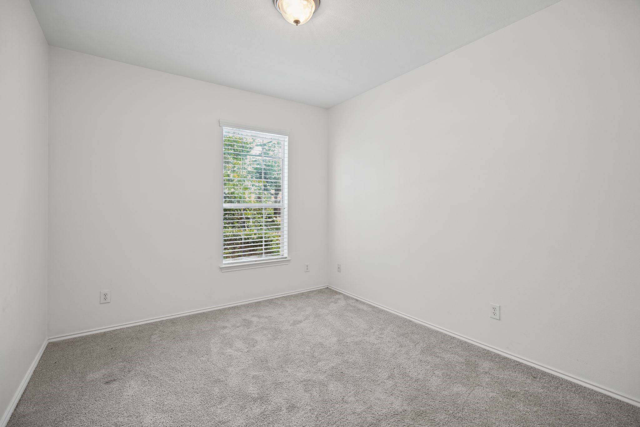 A second downstairs bedroom offers a welcoming space for guests or a great option for multigenerational living.