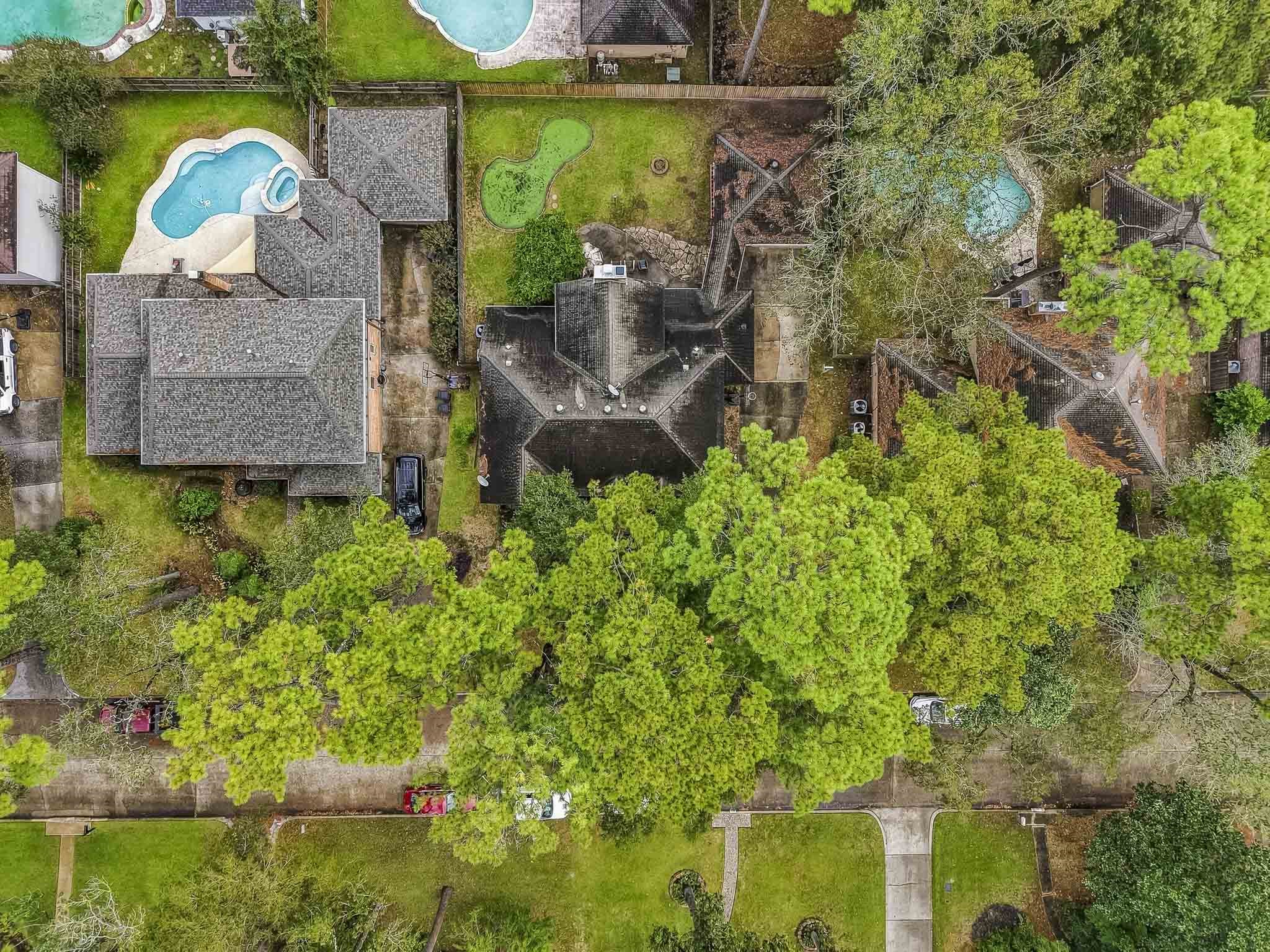 Nestled in a lush, tree-lined neighborhood, this property features a spacious lot.