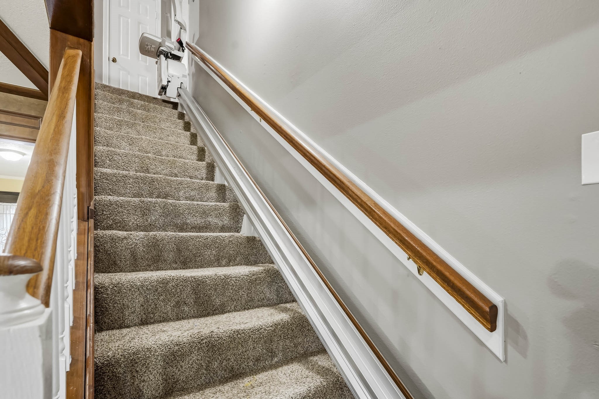 Carpeted staircase.