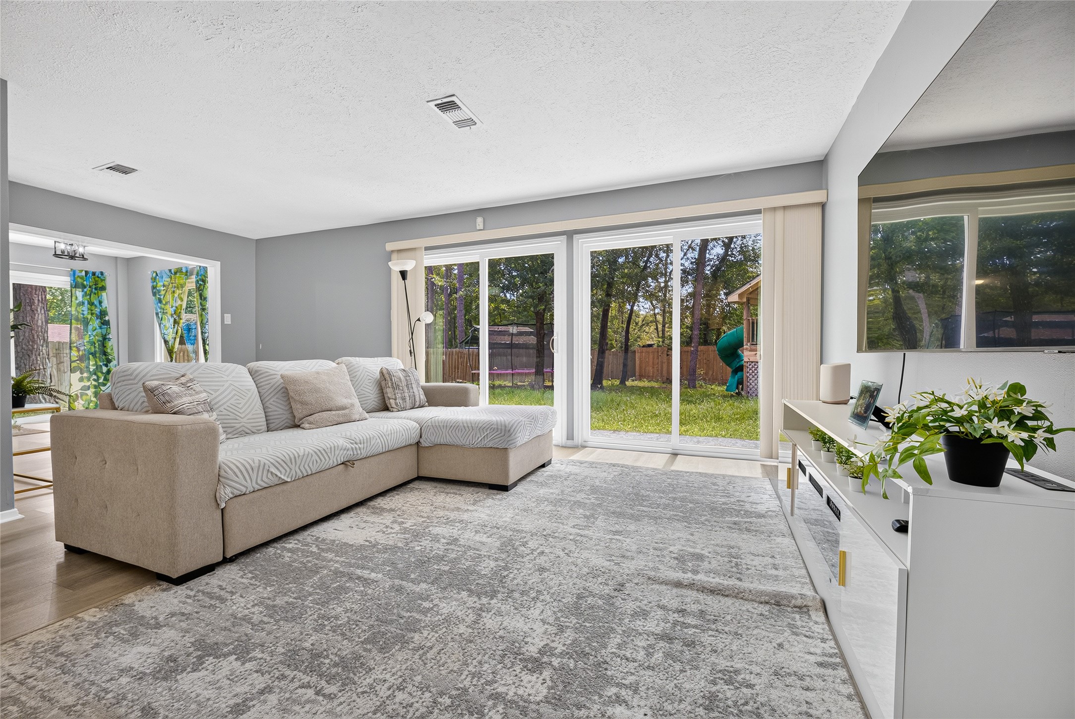 Living room - sliding double pane glass doors open to backyard