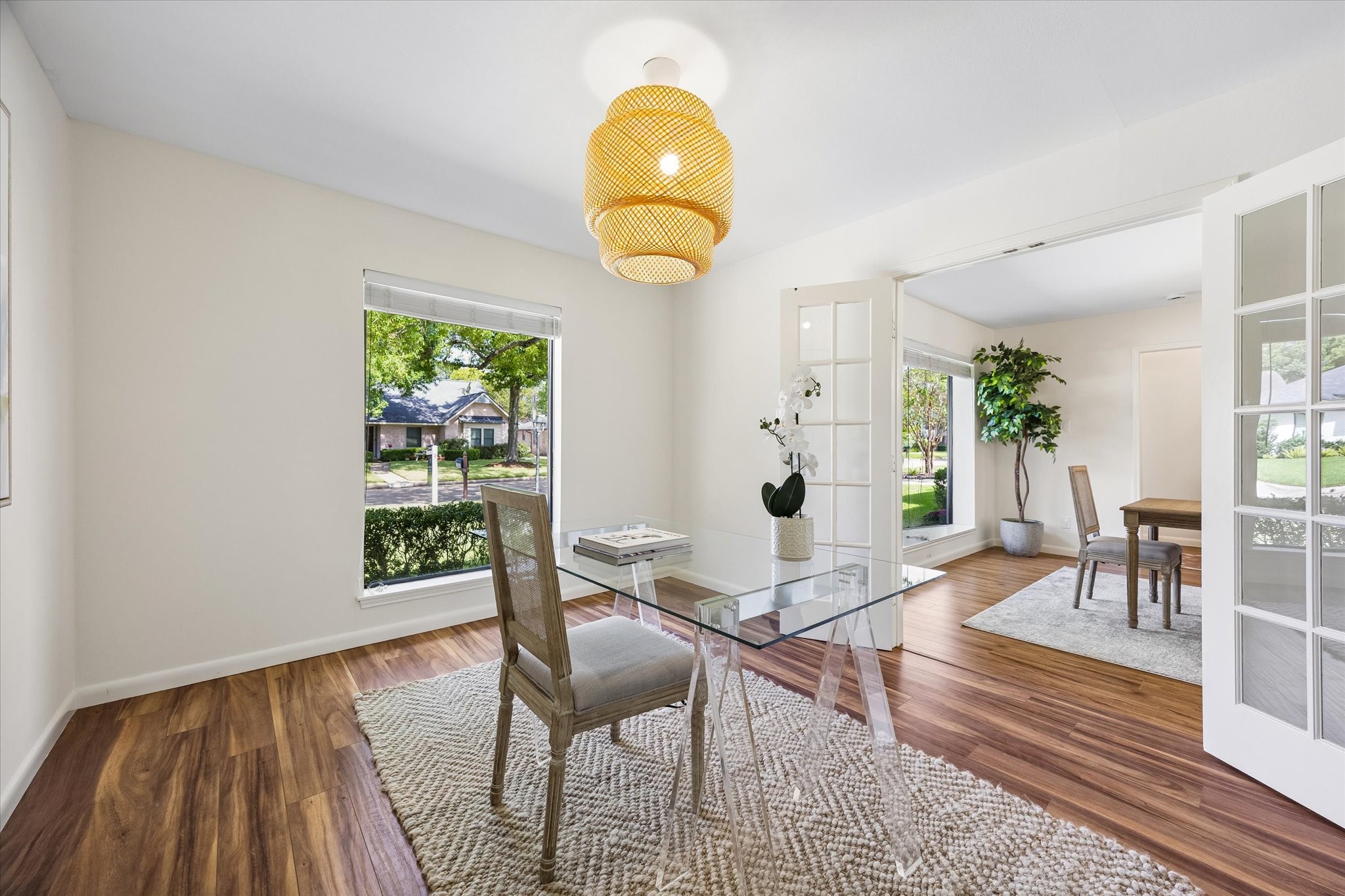 Just off the formal dining room, the office is accessed through elegant French doors, offering a quiet and private space.