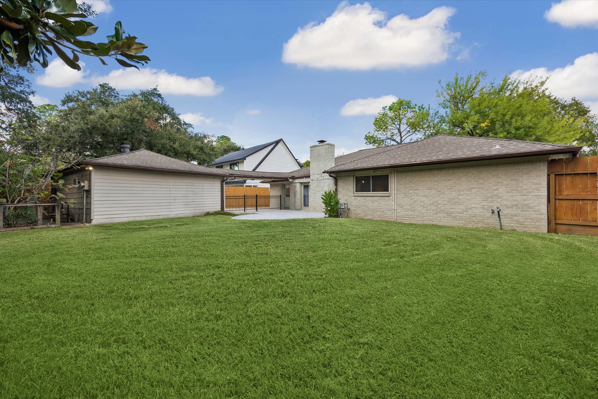 The oversized backyard provides a deep stretch of green space with plenty of room to customize the footprint to your liking!