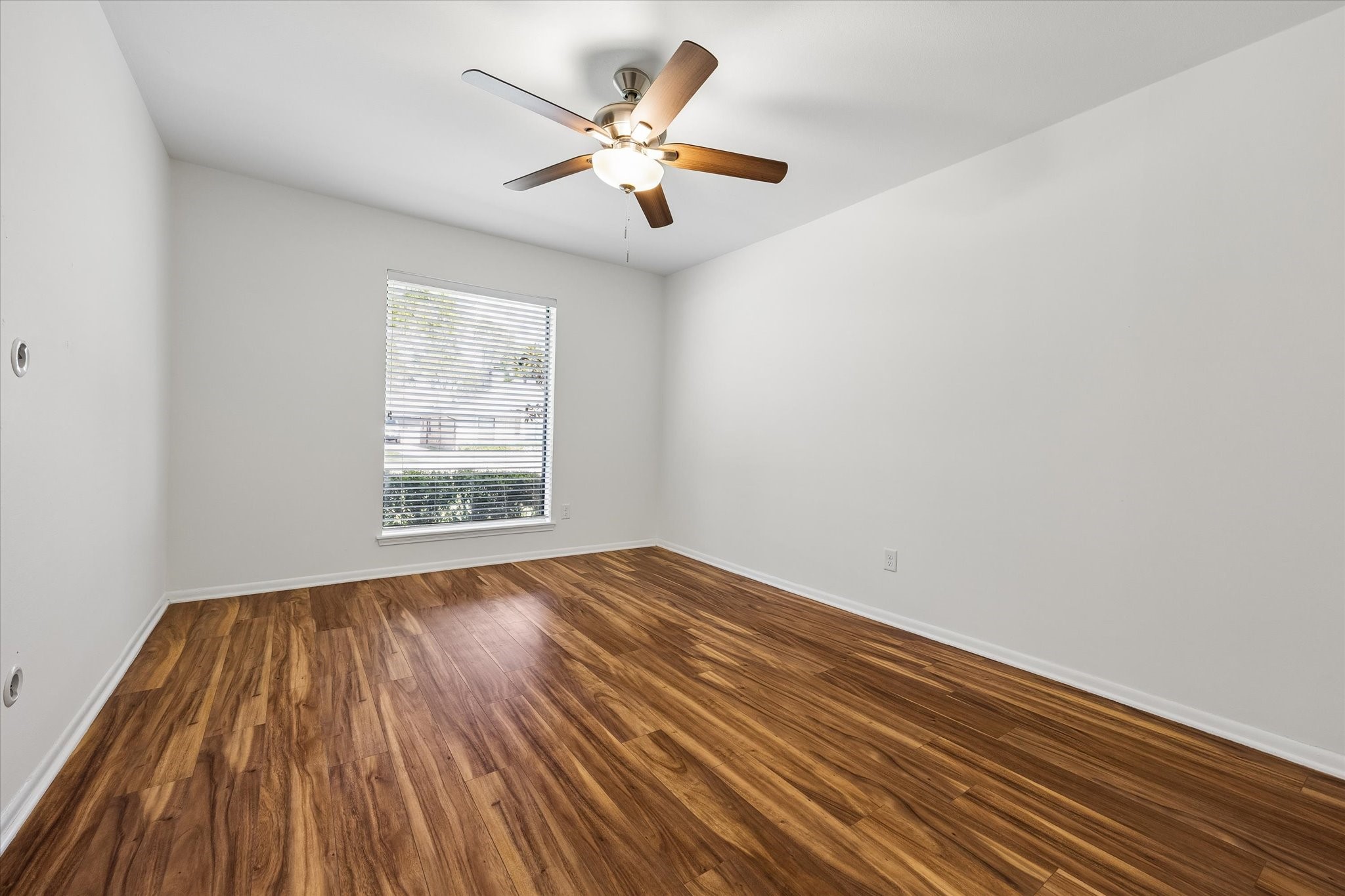 One of three guest bedrooms with great closet space and ceiling fan.