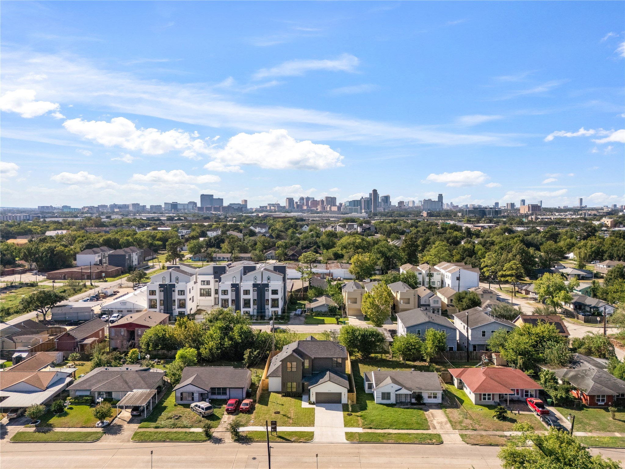 With the Downtown Houston skyline on the horizon, this aerial perspective highlights the property's connection to the surrounding city.