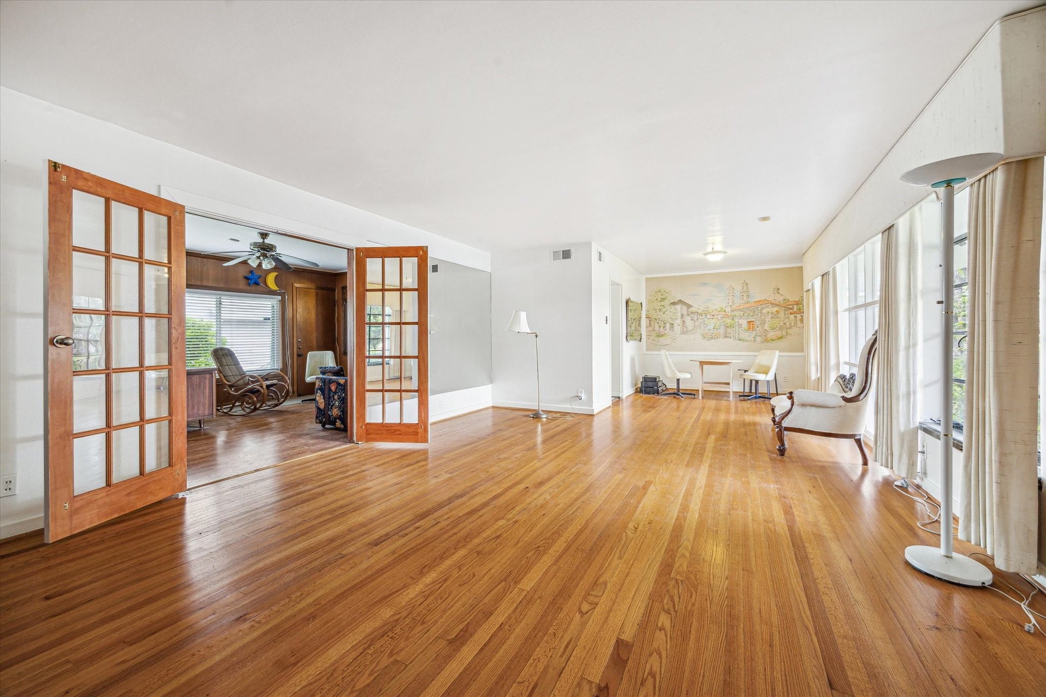 Very large living and formal dining area.  Wonderful abundance of natural light and beautiful hardwood floors.