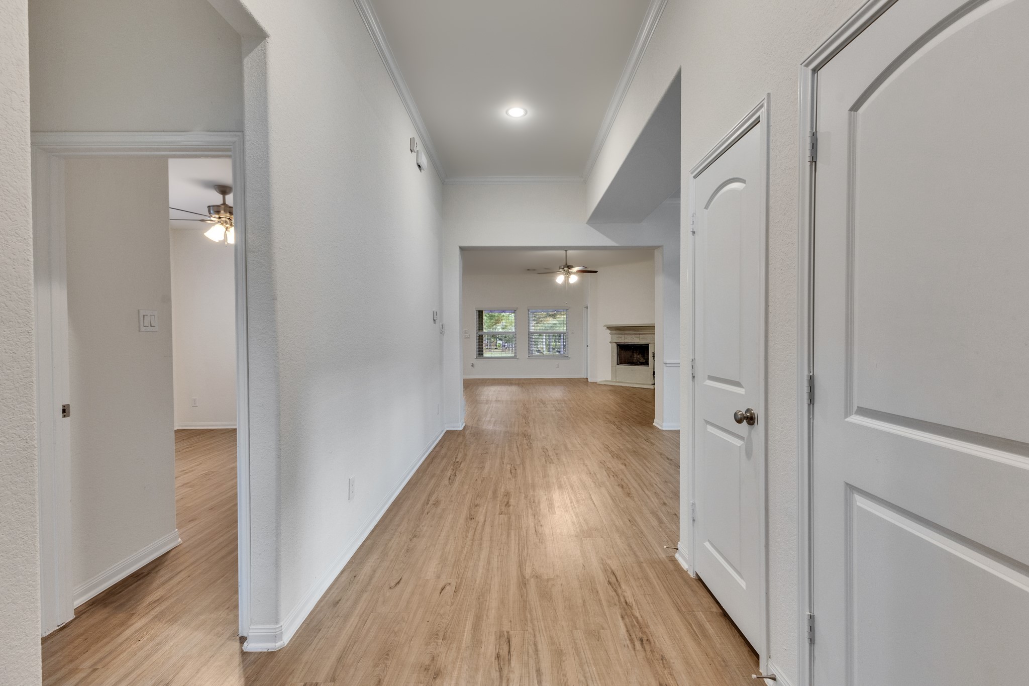 Entryway with coat closet and direct entry from the garage into laundry room