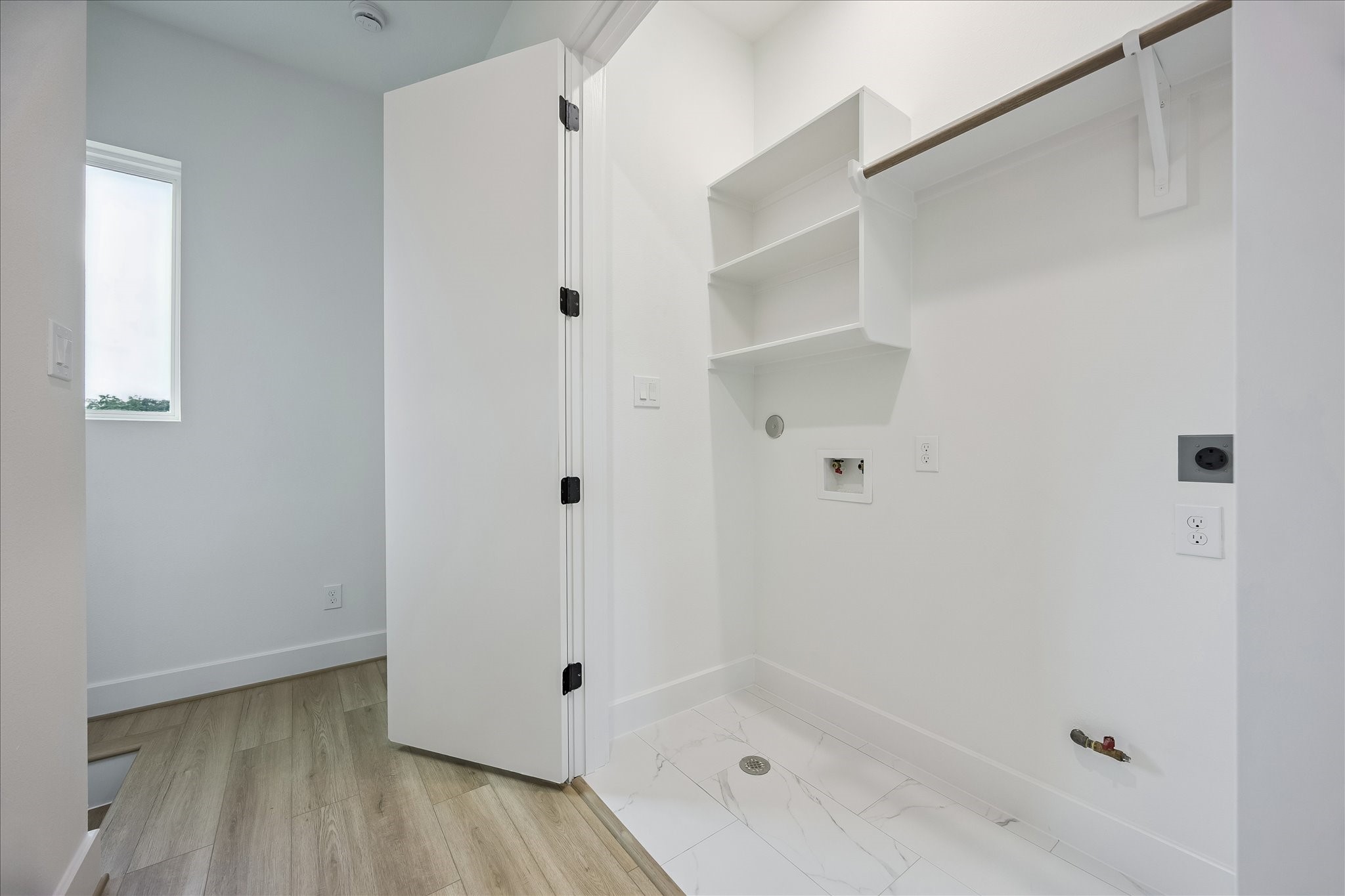 The centrally located utility room is conveniently situated between the bedrooms and is equipped for either a gas or electric dryer.
