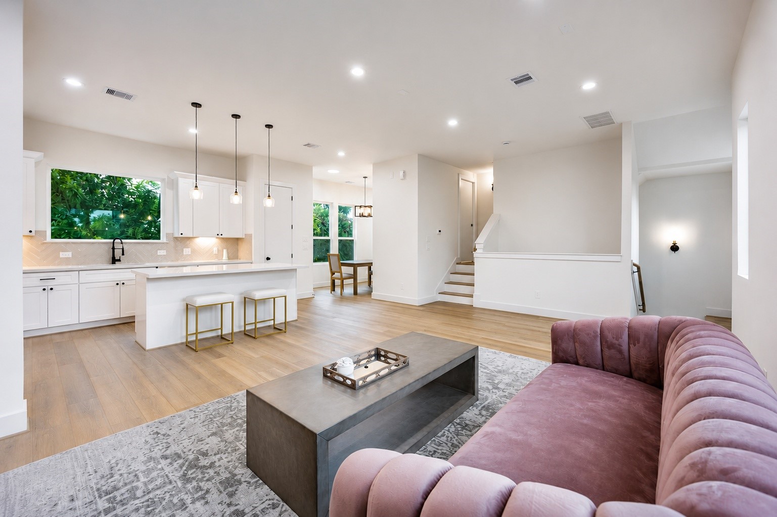 From this vantage point, you can appreciate the openness of the second floor. Notice the door just beyond the short flight of stairs.  We'll explore that space next.