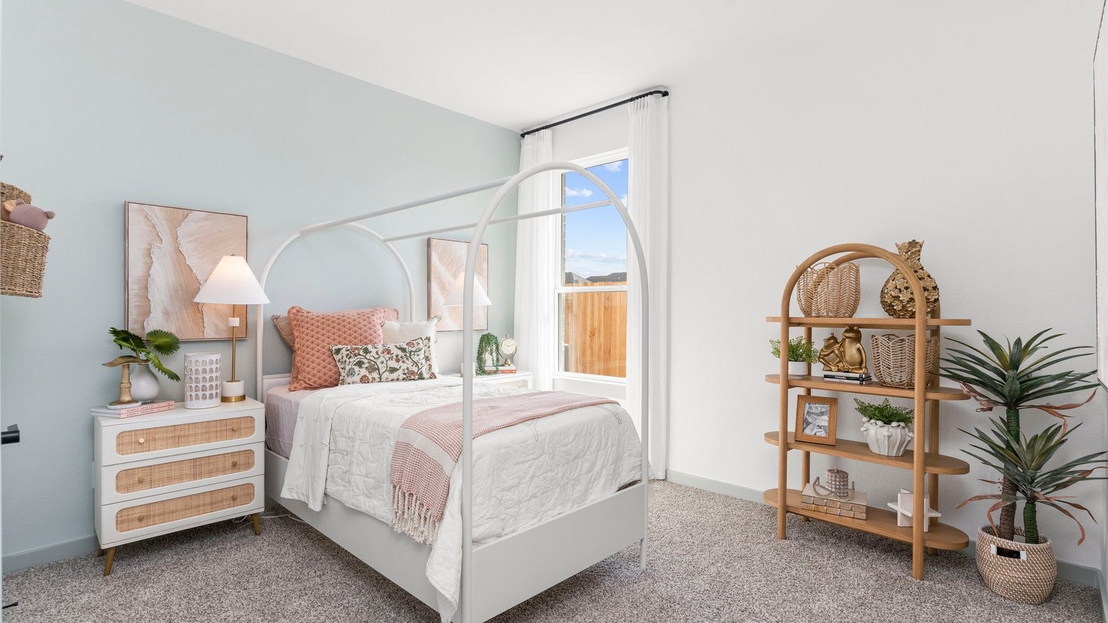 A second bedroom with neutral toned walls, carpet flooring and a separate closet.