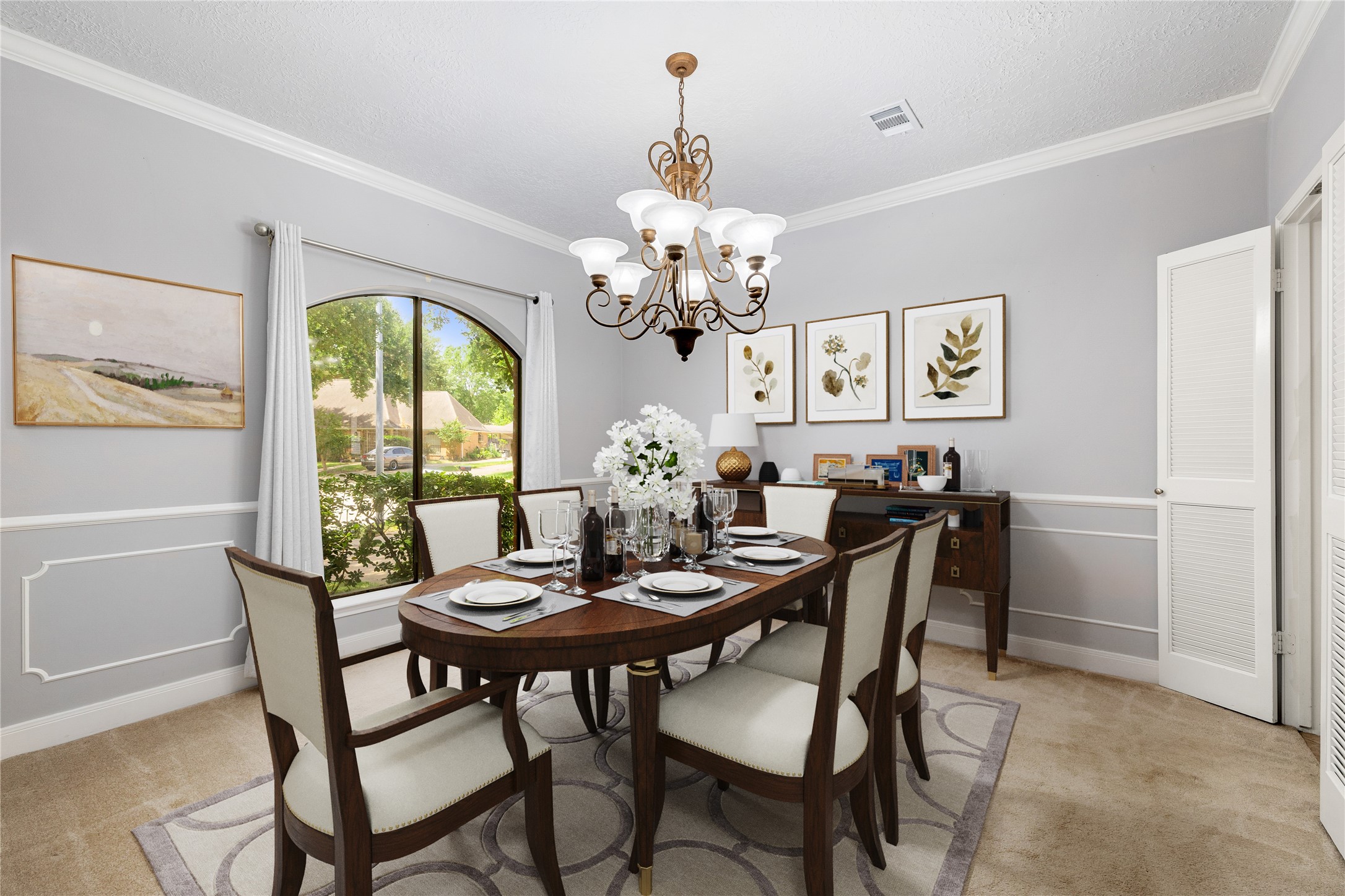 You and your guests will certainly dine in style in this amazing formal dining room, located in the front of the home! Featuring a gorgeous chandelier, large arched window, neutral paint, high ceilings, crown molding, chair rail and plush carpet flooring! Perfect space to entertain family and friends! *Virtually Staged