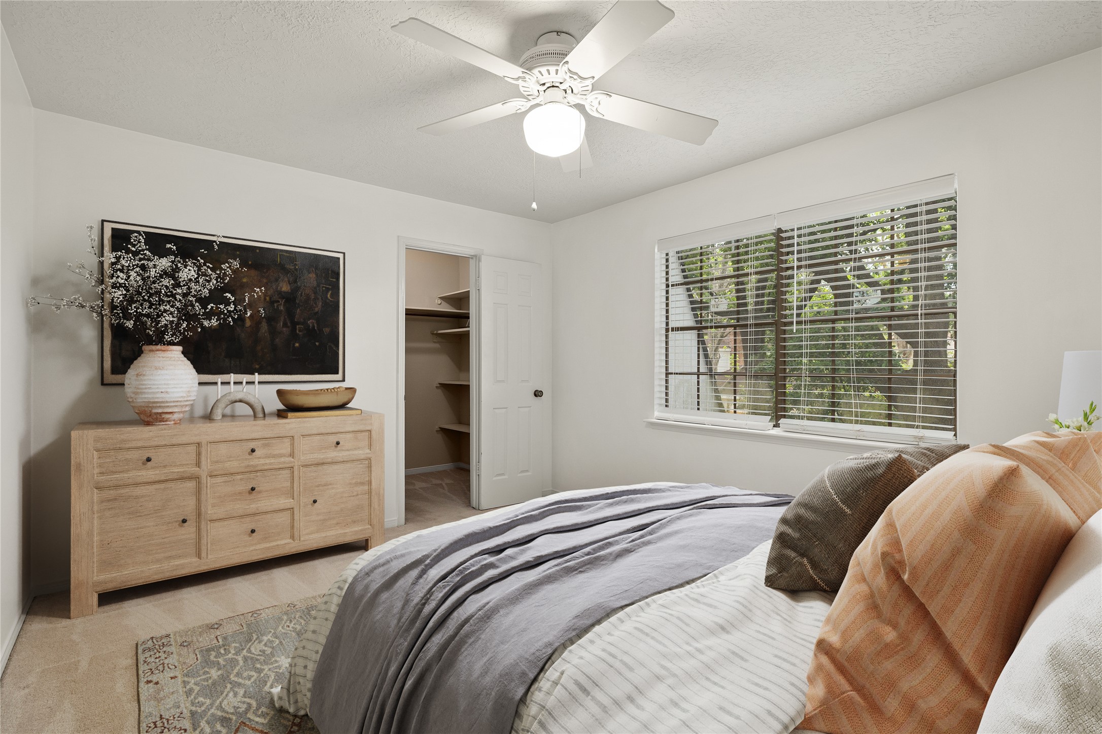 This bright and versatile secondary bedroom offers a comfortable retreat with a clean, modern aesthetic. The room is bathed in natural light from the large windows, creating an inviting space that can easily serve as a guest suite or childs room. *Virtually Staged