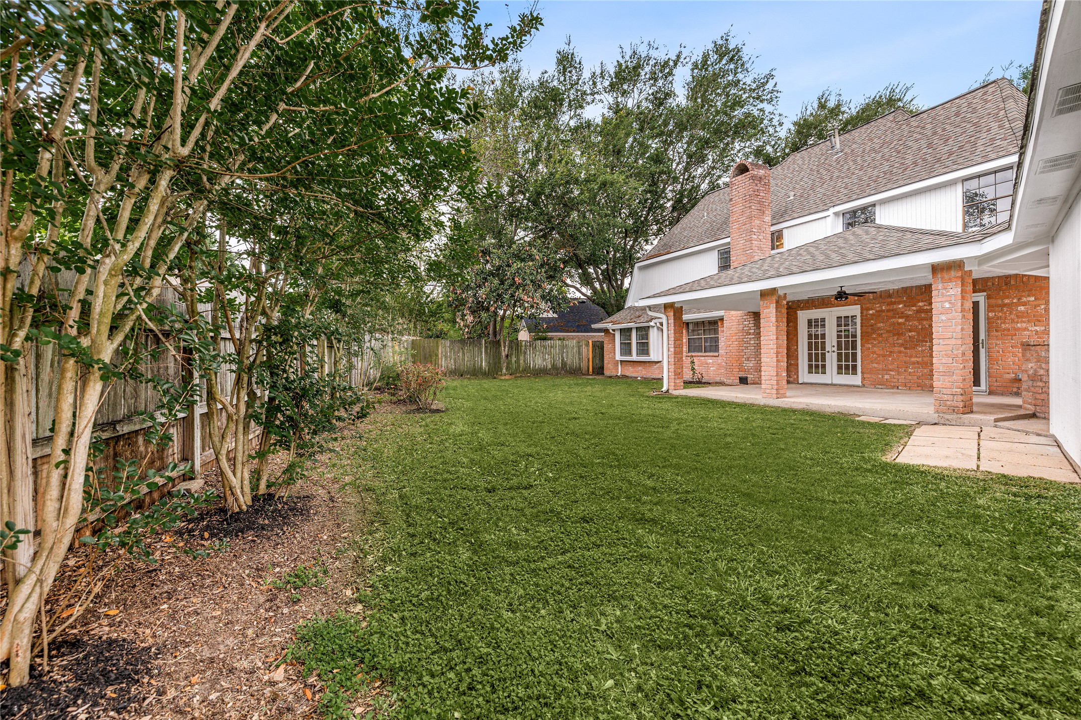 This expansive backyard is a true hidden gem, offering a peaceful and private retreat with plenty of room to roam. Framed by mature trees that provide natural shade and character, the level green lawn is a versatile space for gardening, outdoor play, or your future backyard projects.