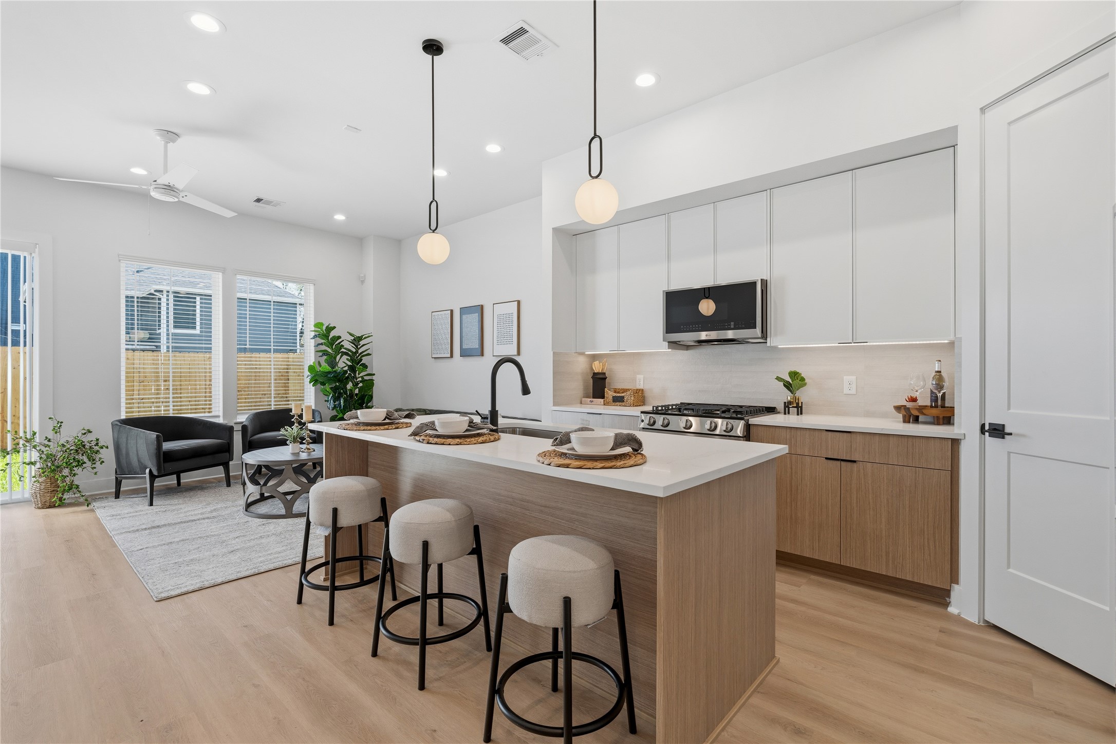 Open-concept living space with 10 ceilings, defined seating area, and easy flow into the kitchen and dining. Open-concept living space with 10 ceilings, defined seating area, and easy flow into the kitchen and dining.