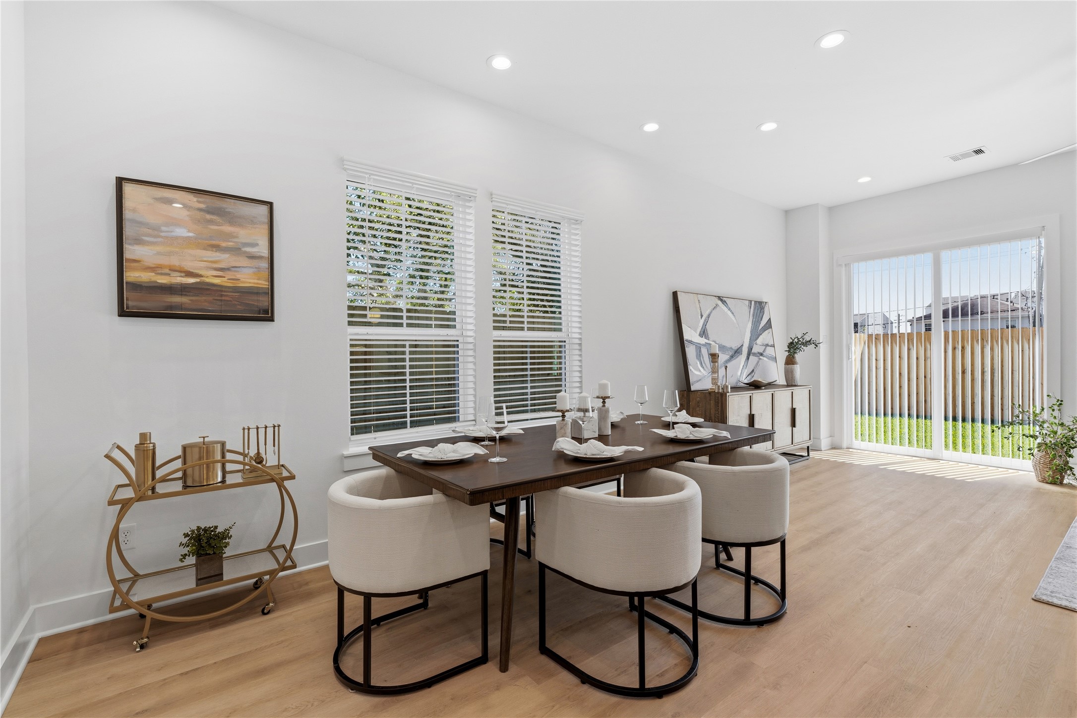 Open-concept living space with 10 ceilings, defined seating area, and easy flow into the kitchen and dining.