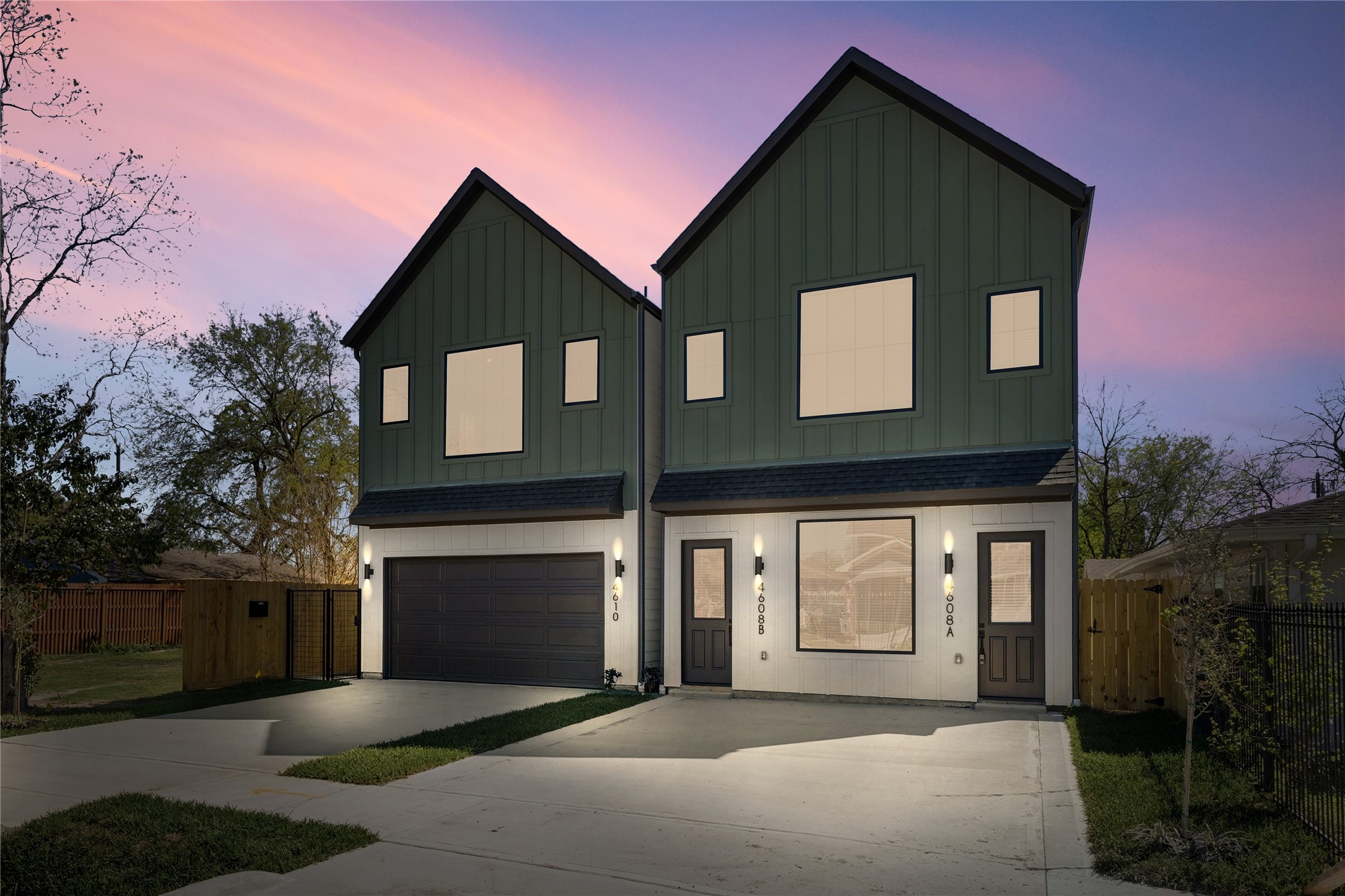 Modern farmhouse exterior with clean lines, private driveway, and a attached 2-car garage.