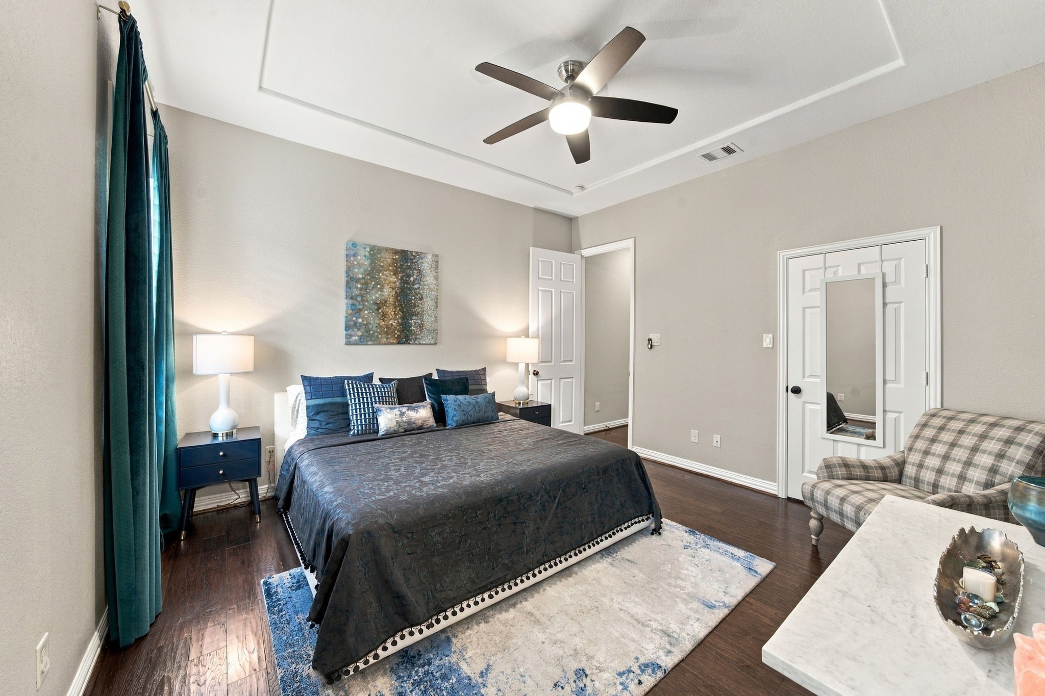 This additional bedroom on the first floor offers a cozy yet comfortable space for guests.