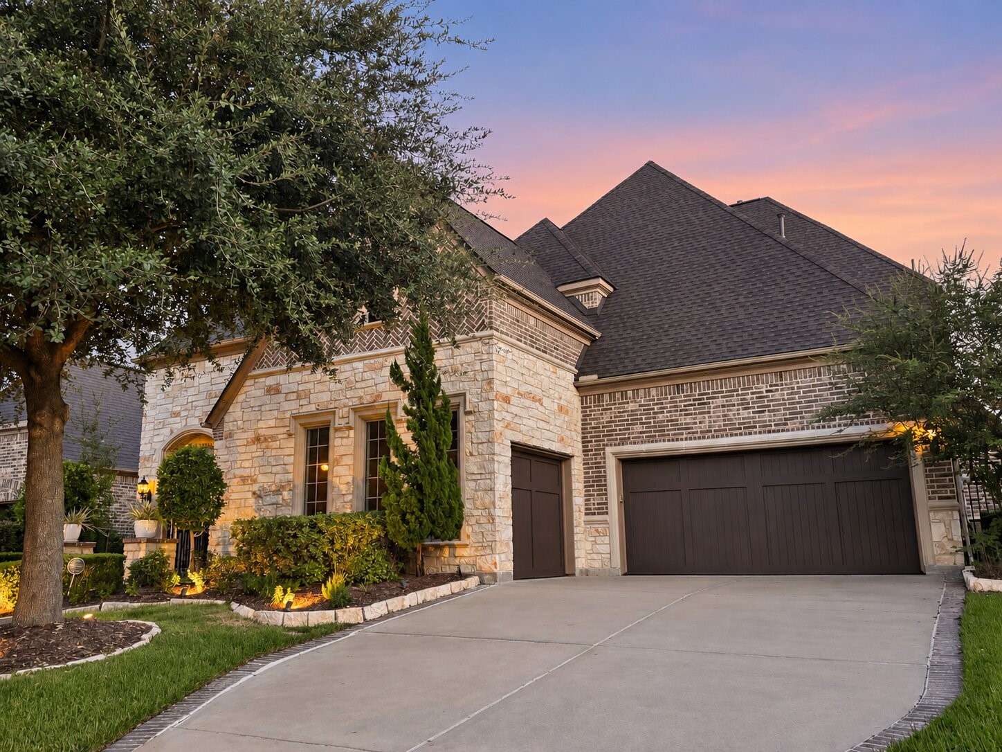 The homes impressive exterior includes a spacious three-car garage, wide driveway and thoughtfully landscaped grounds.