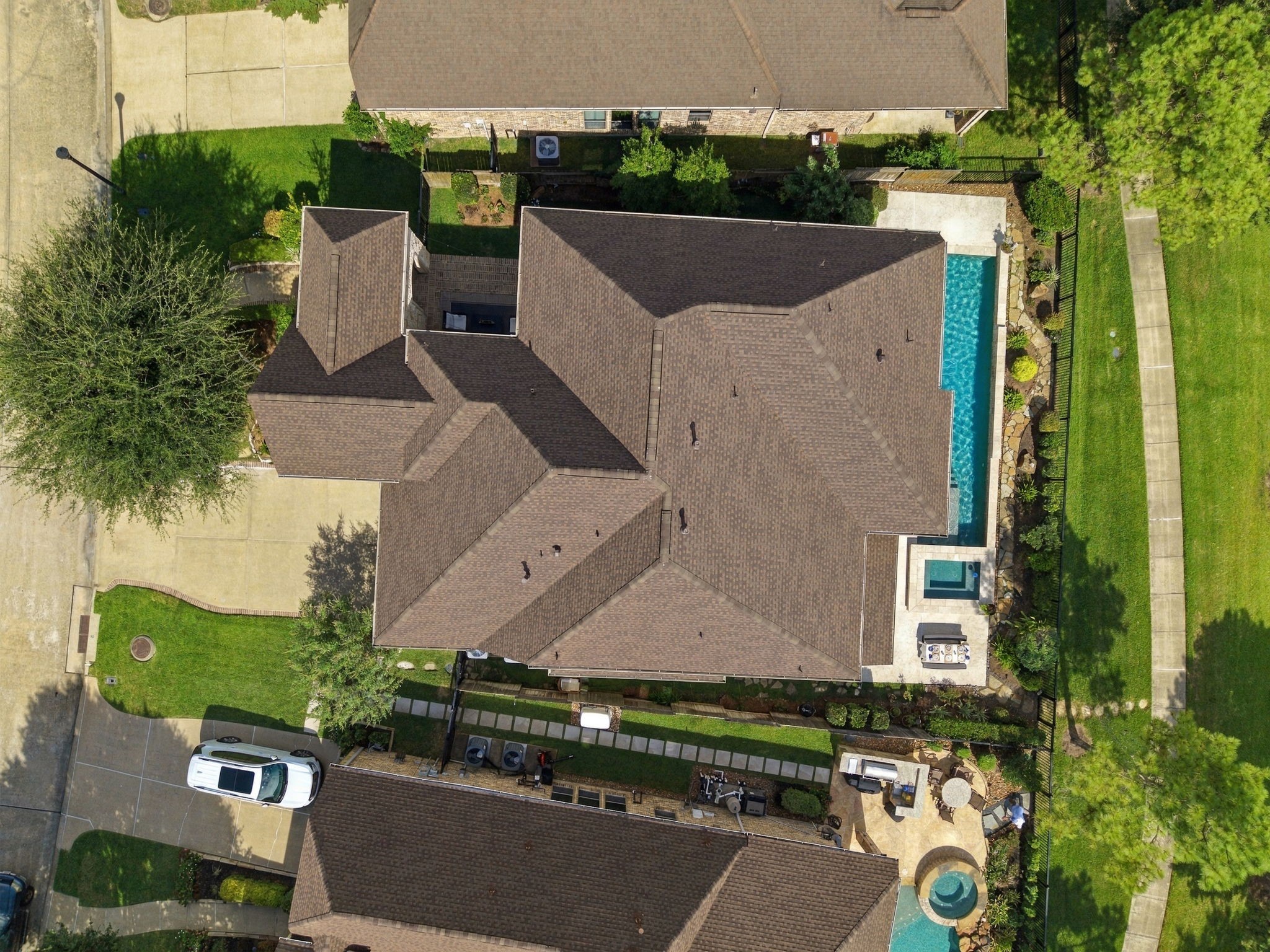 Aerial view reveals the exceptional use of space, featuring an expansive residence, private pool and outdoor retreat.