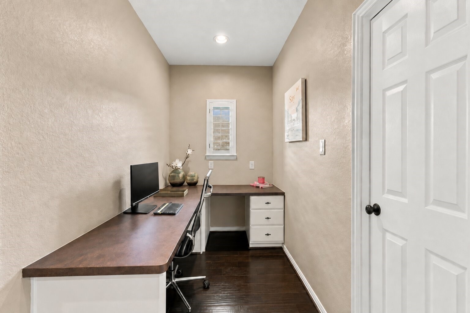 This separate office nook features an extended workspace adjacent to the secondary bedroom and full bath, creating a flexible, private suite-like area on the second floor.