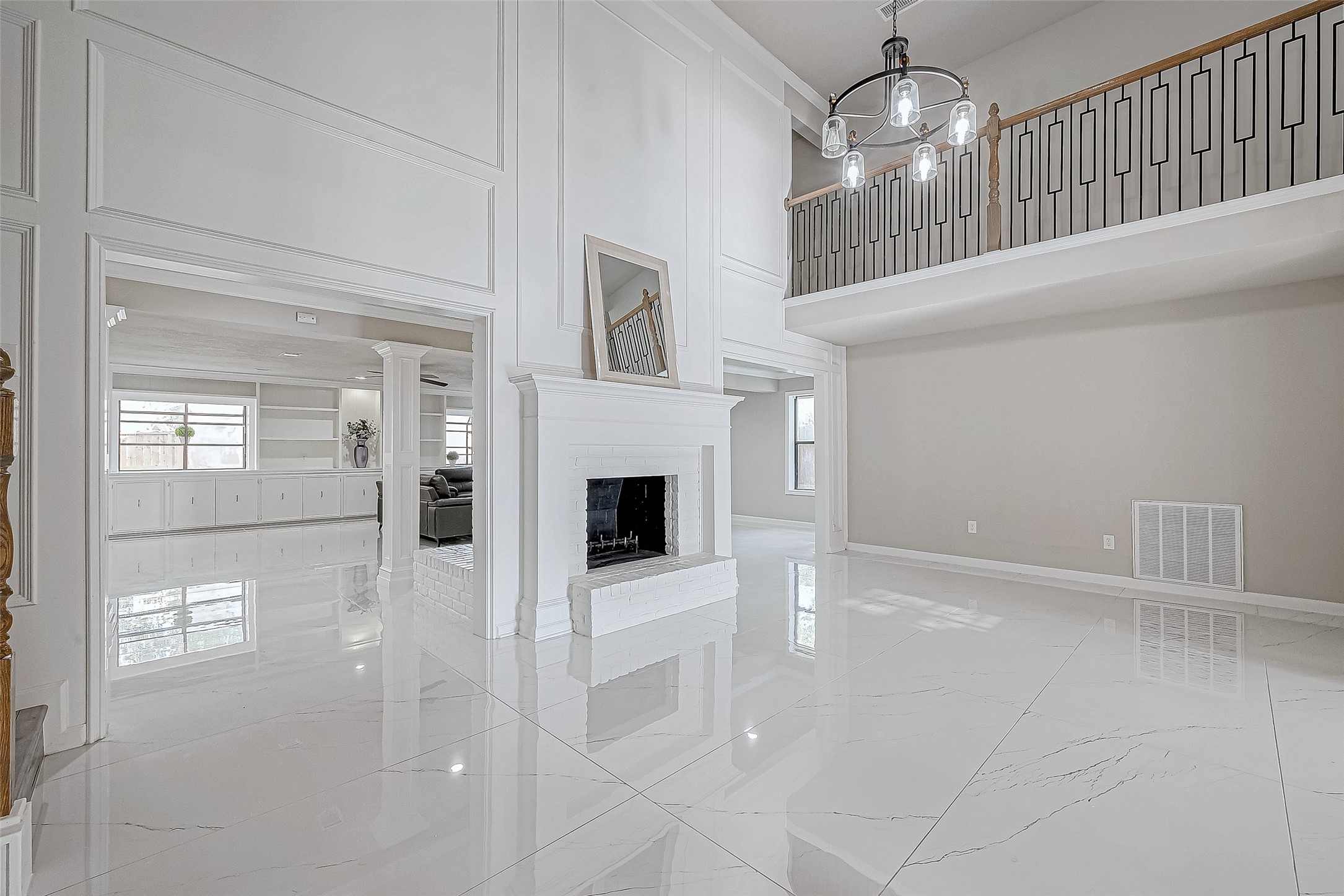 The living area features a central fireplace that adds warmth, while the open layout connects seamlessly to adjacent rooms. The living area features a central fireplace that adds warmth, while the open layout connects seamlessly to adjacent rooms.