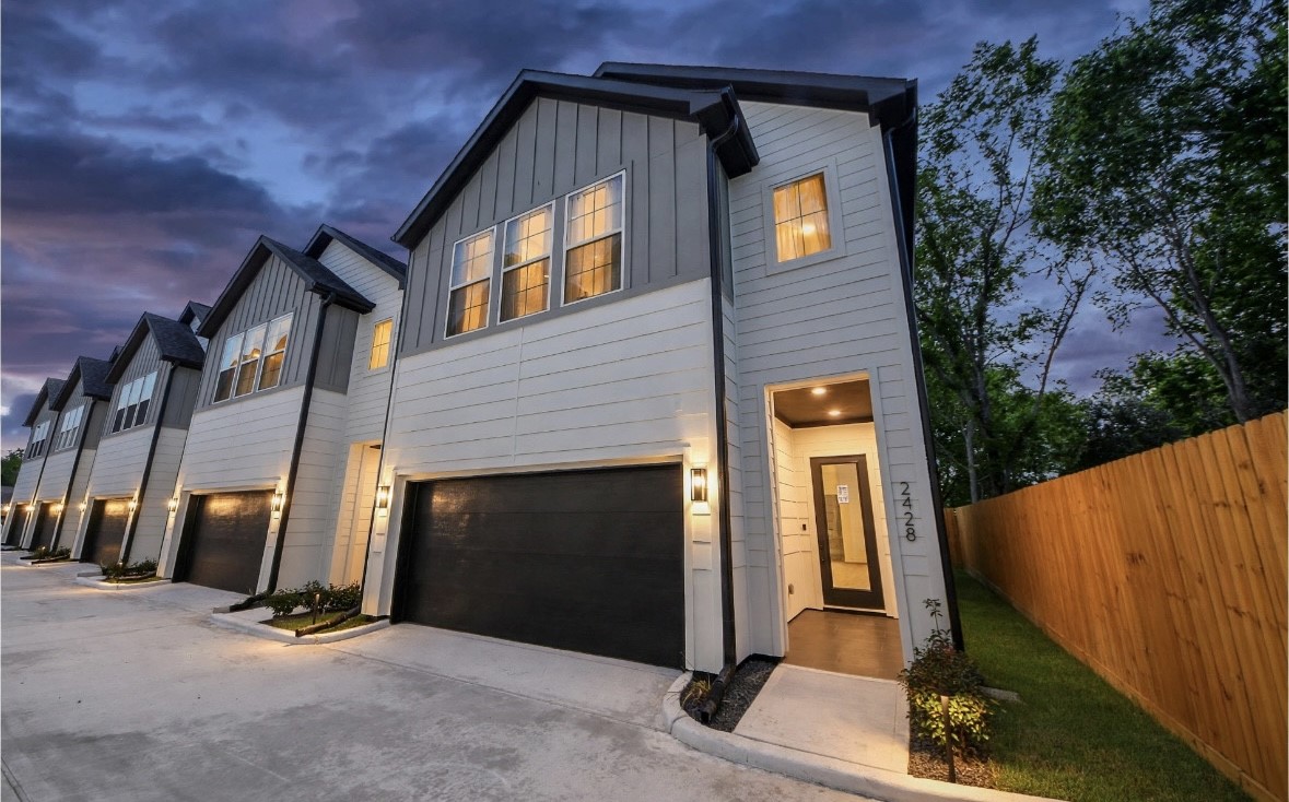 Modern two-story exterior located within a gated community. Clean architectural lines, contemporary design, and a welcoming front entry create a sleek curb appeal.