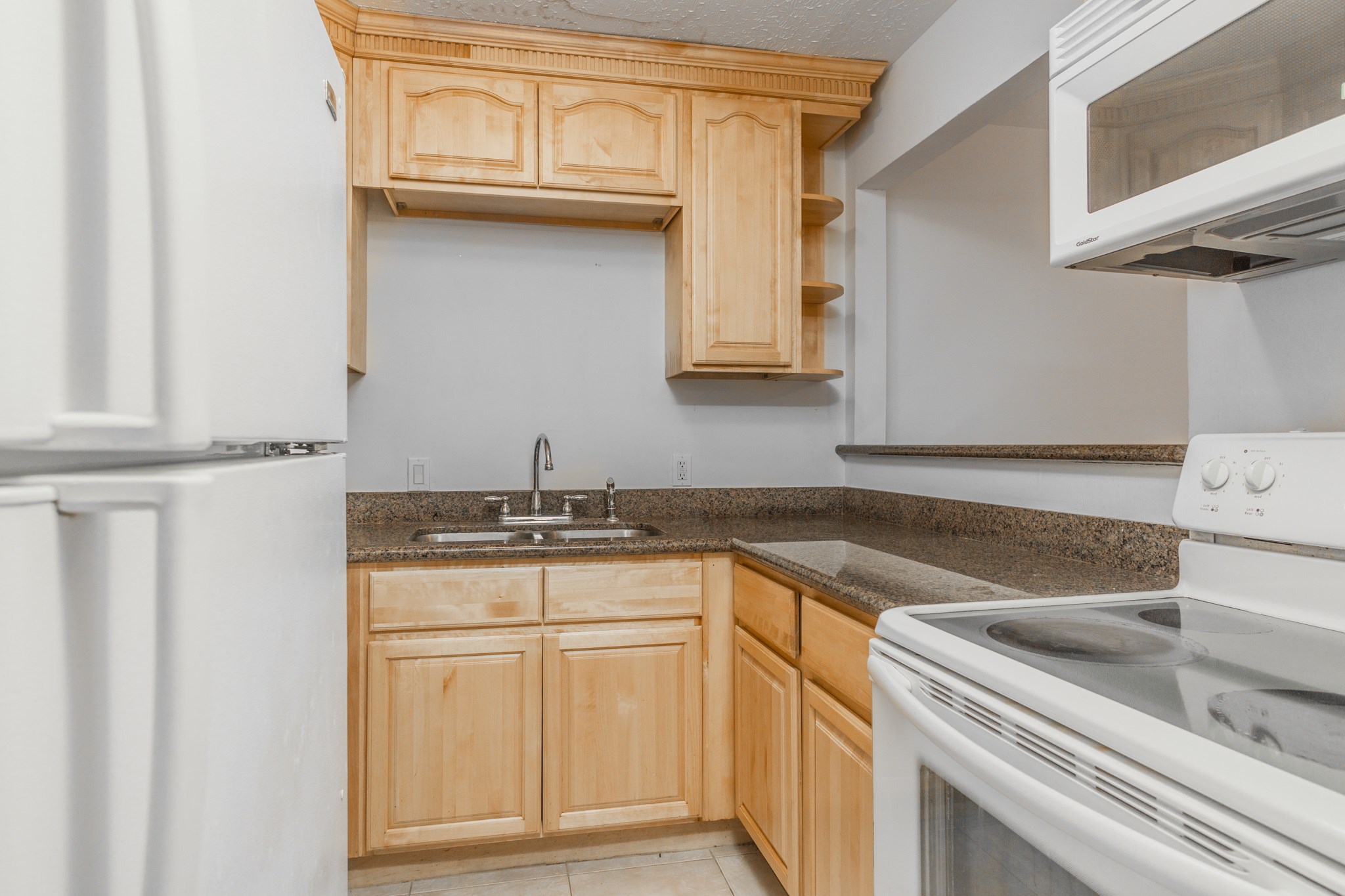 Updated kitchen with granite counters & gorgeous custom cabinets