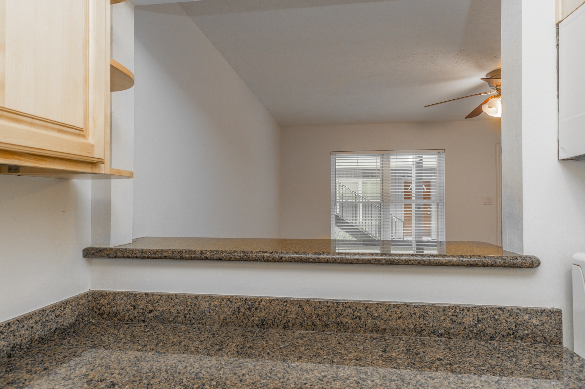 View of the living area from the kitchen's breakfast bar