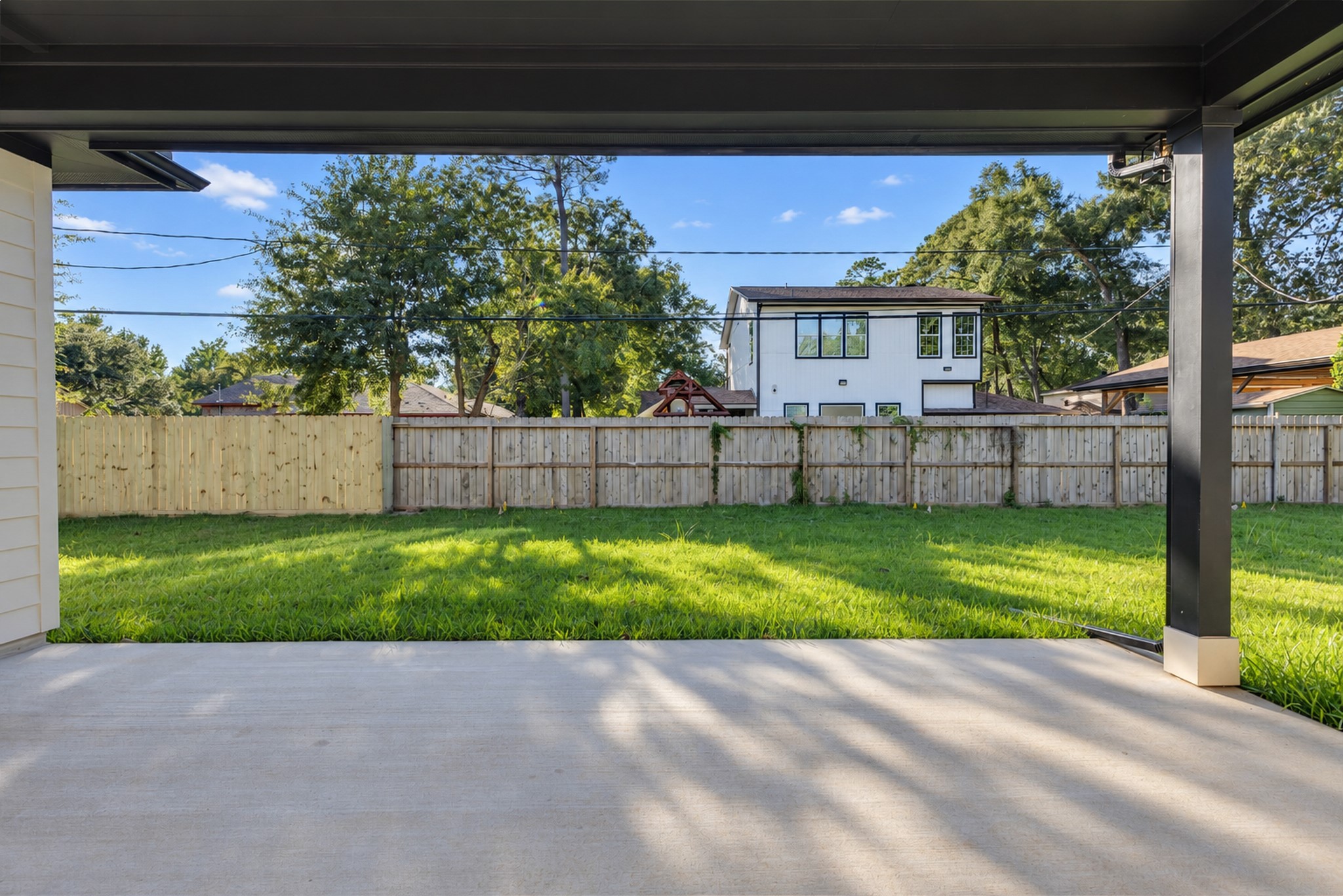 Covered Patio Overlooking the Backyard