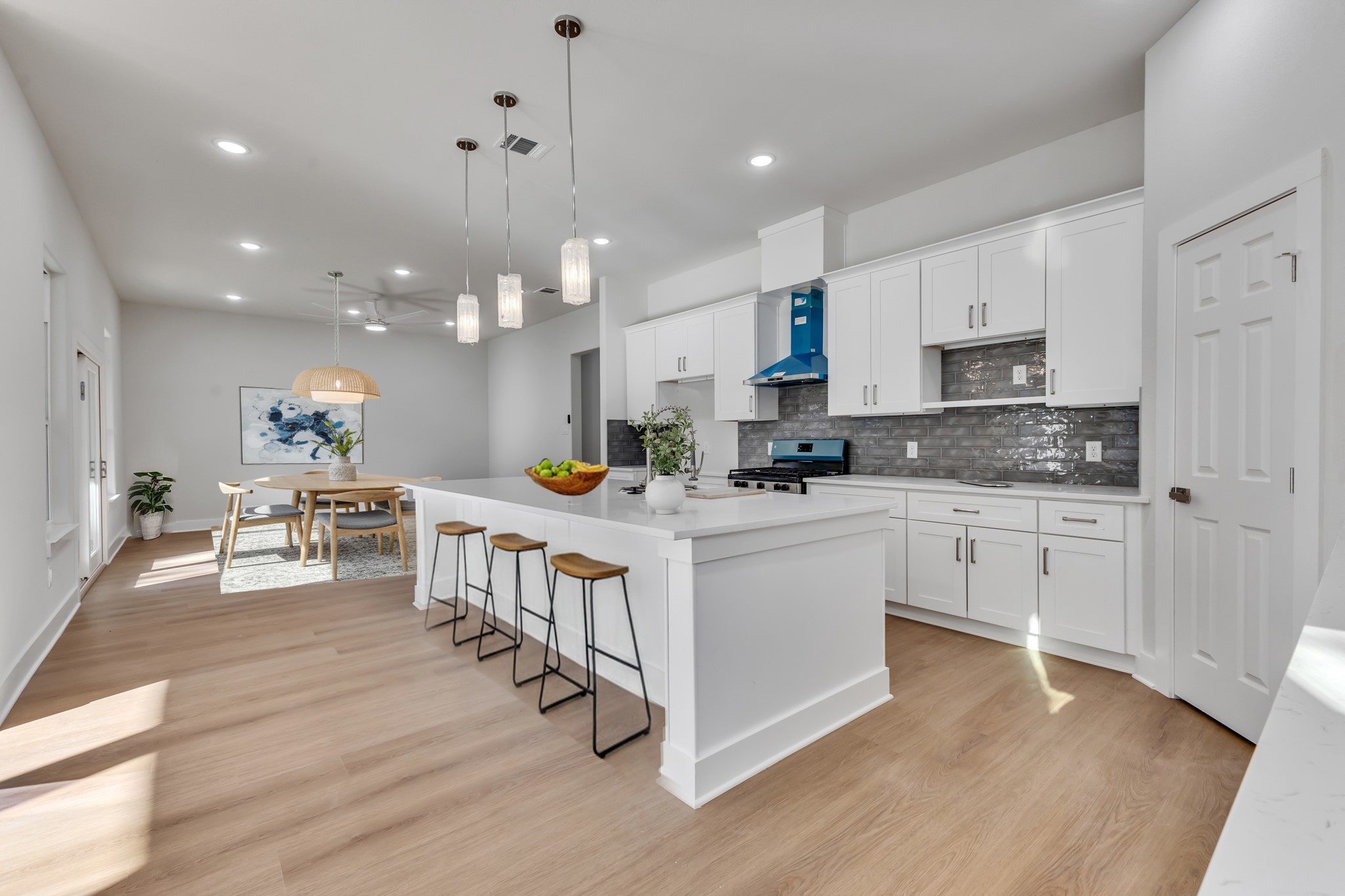 Bright Open-Concept Kitchen & Living Area Bright Open-Concept Kitchen & Living Area