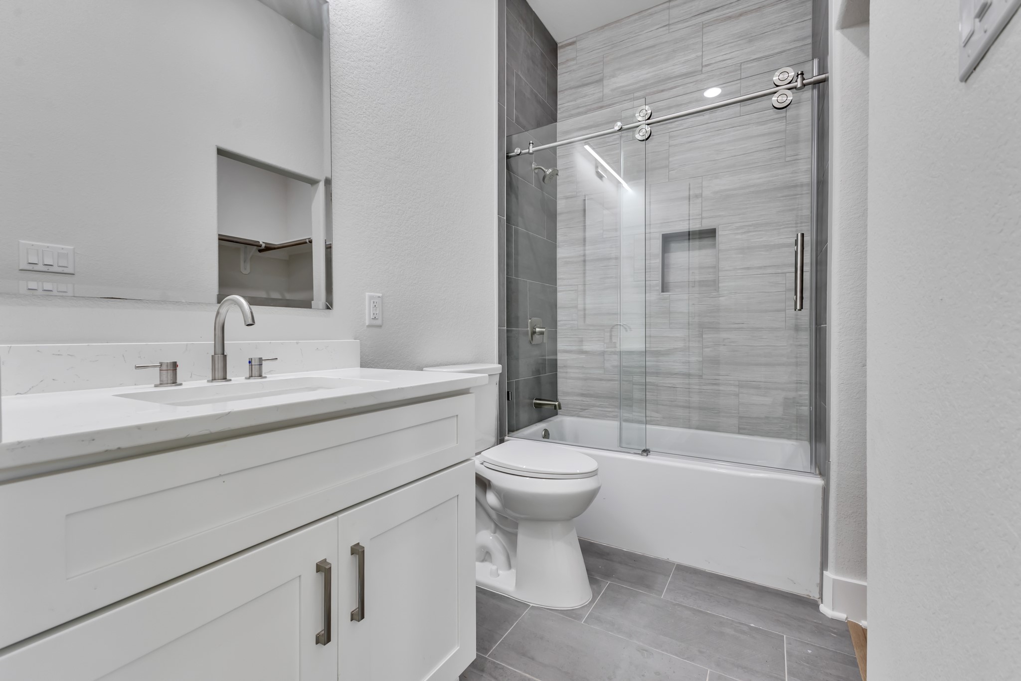 Full Bathroom with Glass-Enclosed Shower