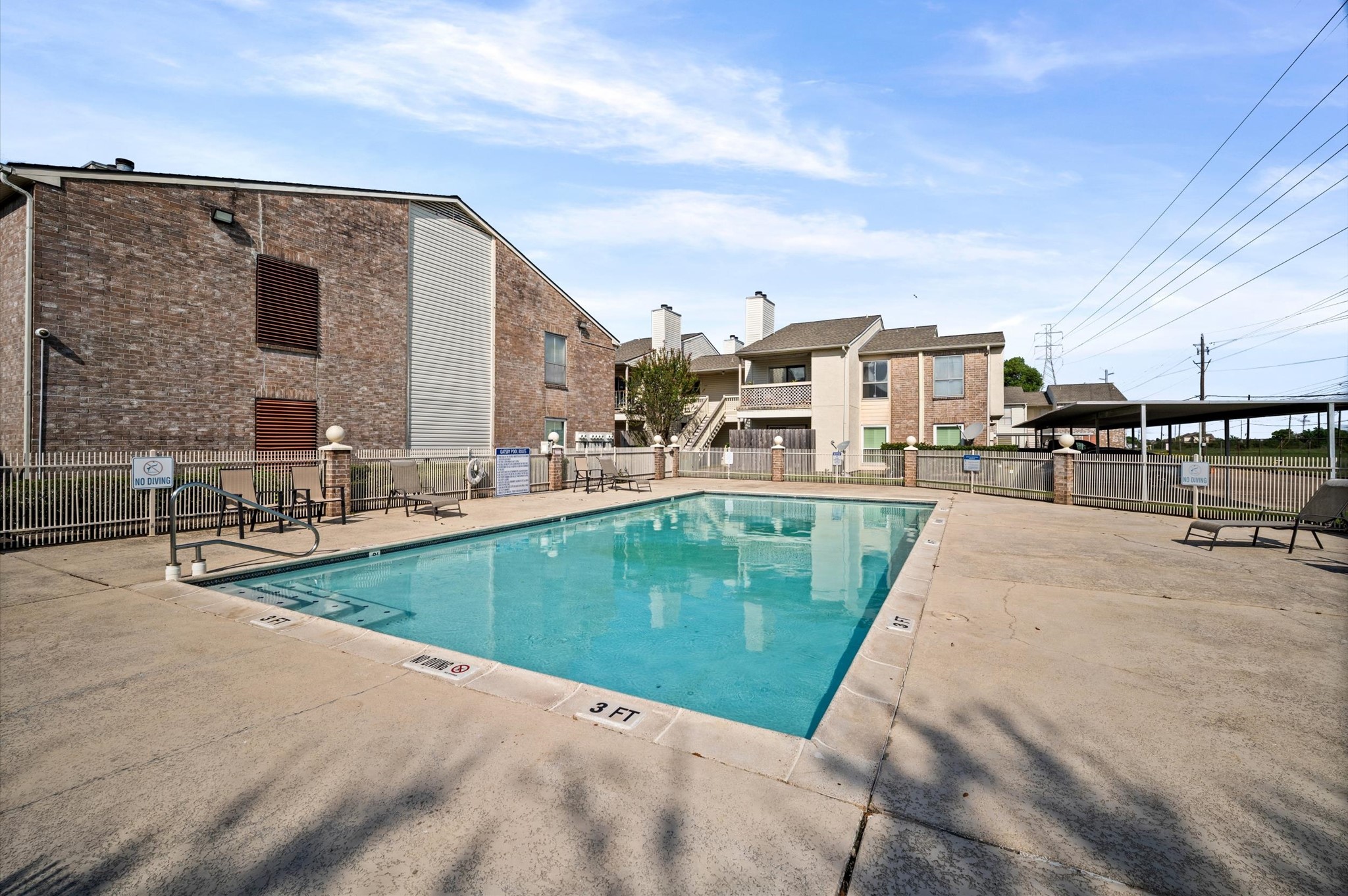 Enjoy leisurely afternoons by the sparkling community pool, surrounded by a spacious sun deck and comfortable seating.