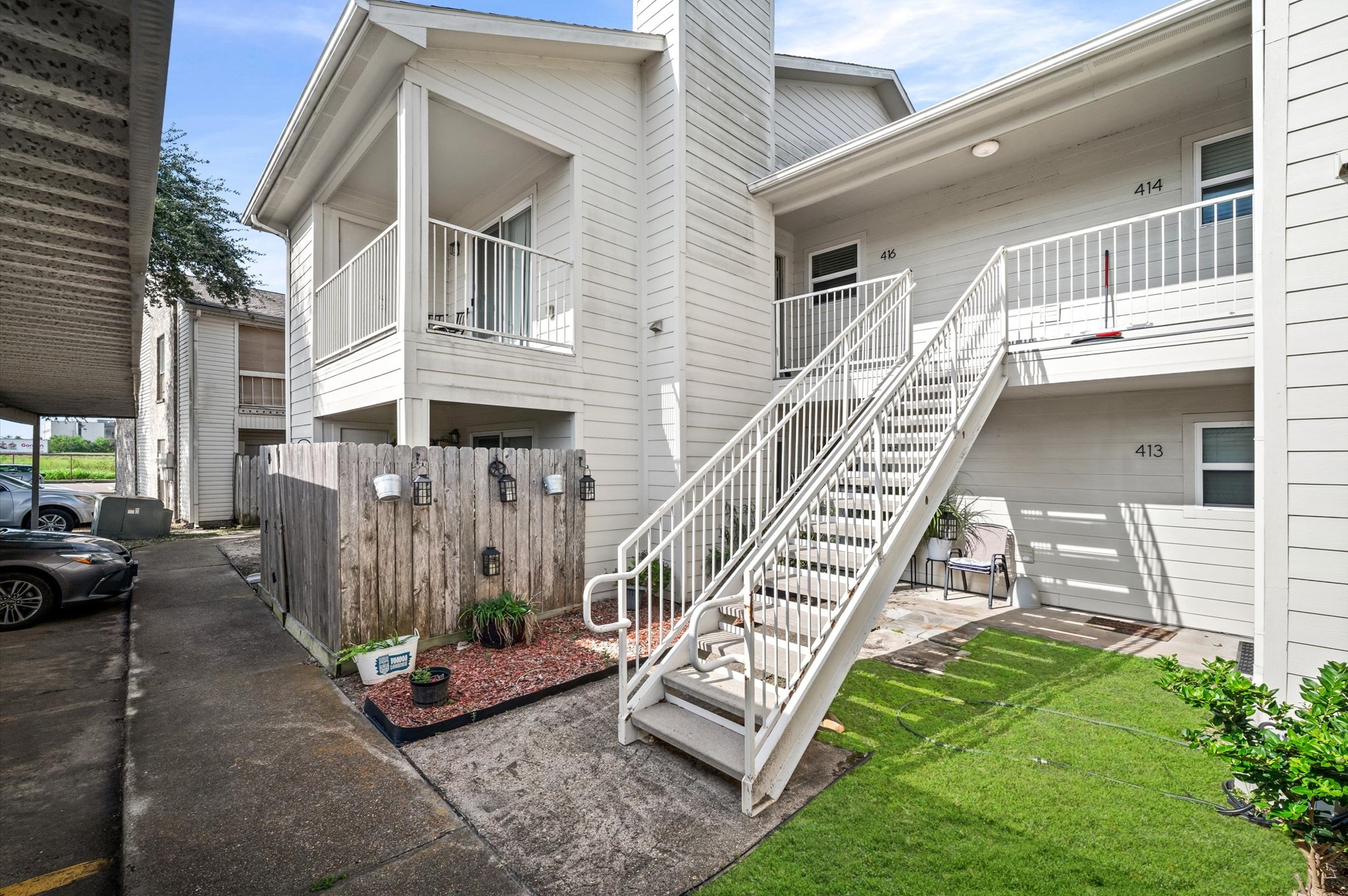 Bright and inviting second-floor unit with a charming balcony, perfect for enjoying relaxed outdoor moments.