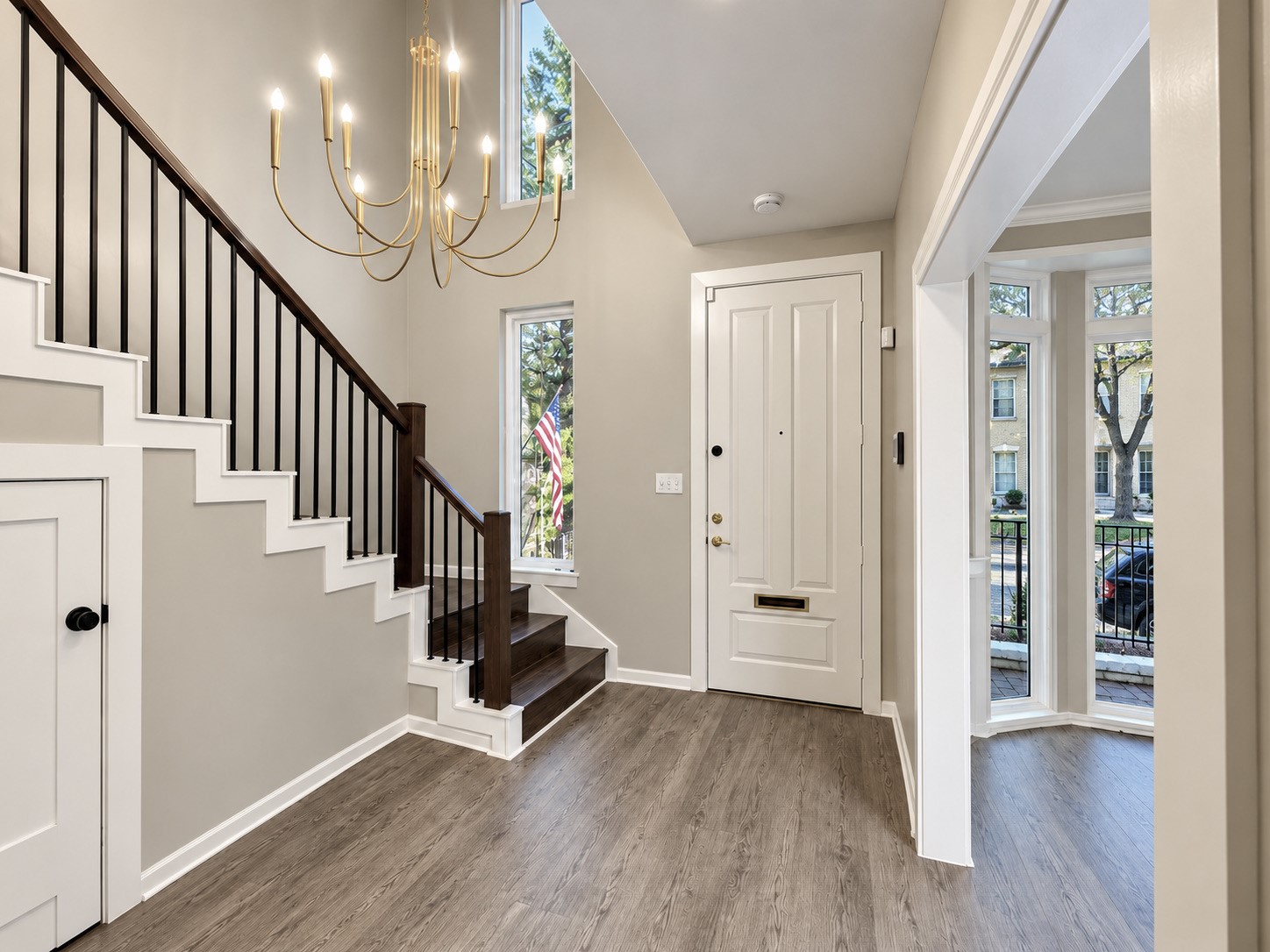 The foyer leads to the living room and also a study/den off the front of the townhouse.