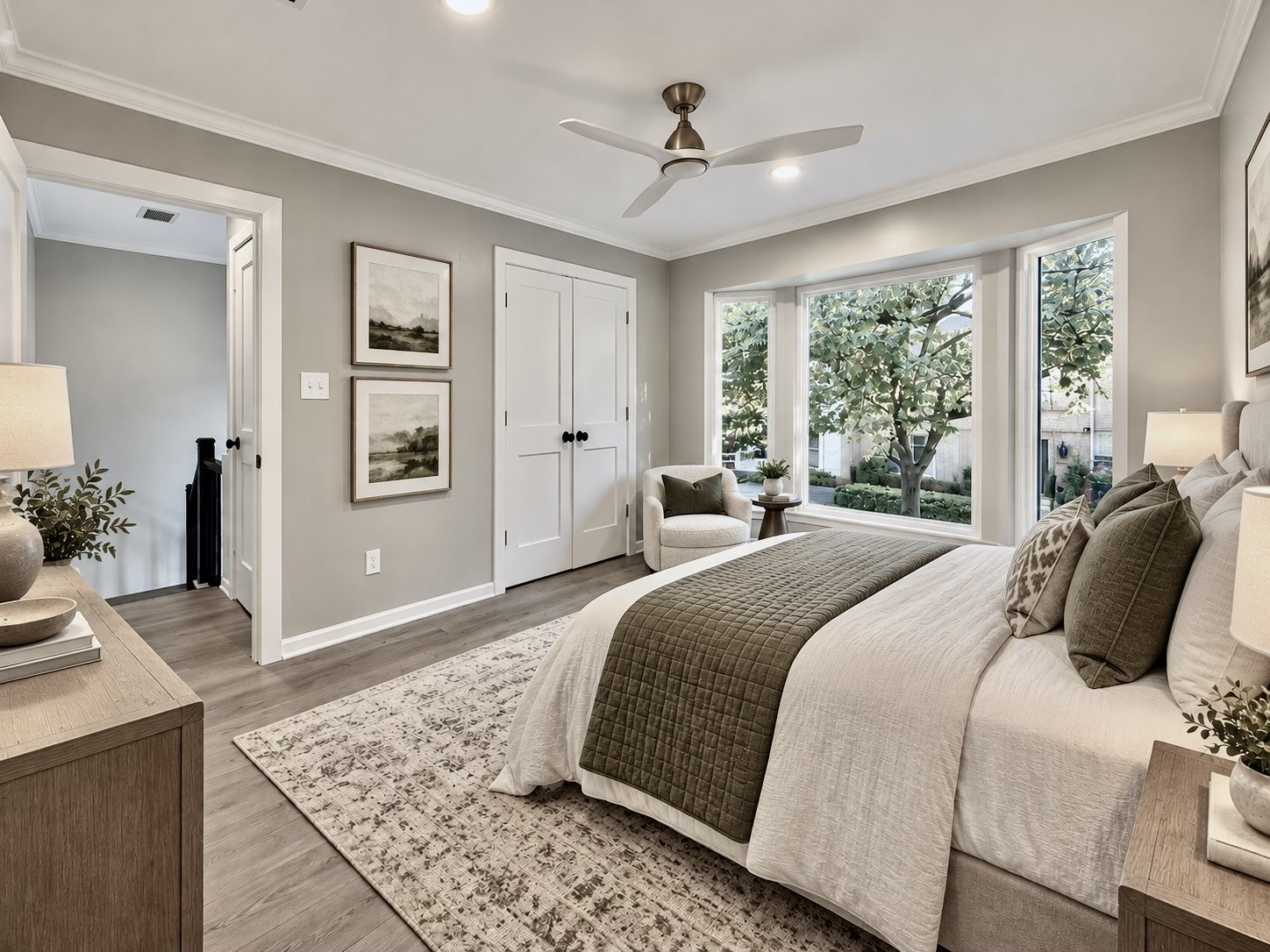 *Virtually Staged* guest bedroom with bay window overlooking the trees and the front of the townhouse.