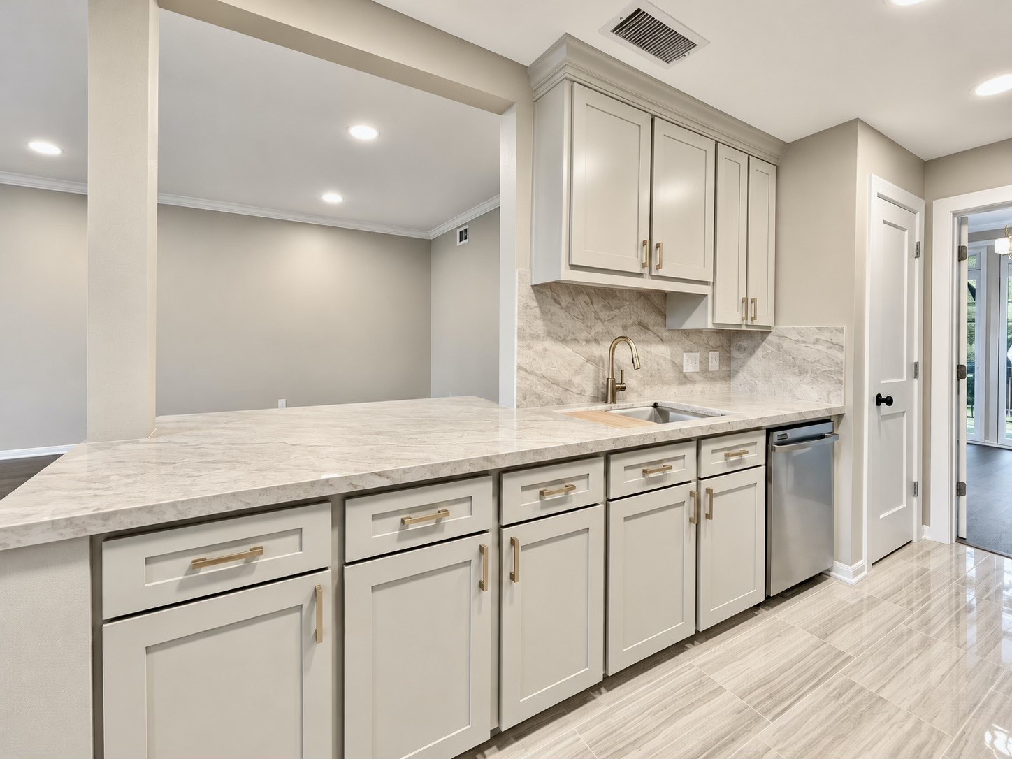 By opening the wall between the kitchen and the living room a great area for entertaining was created.