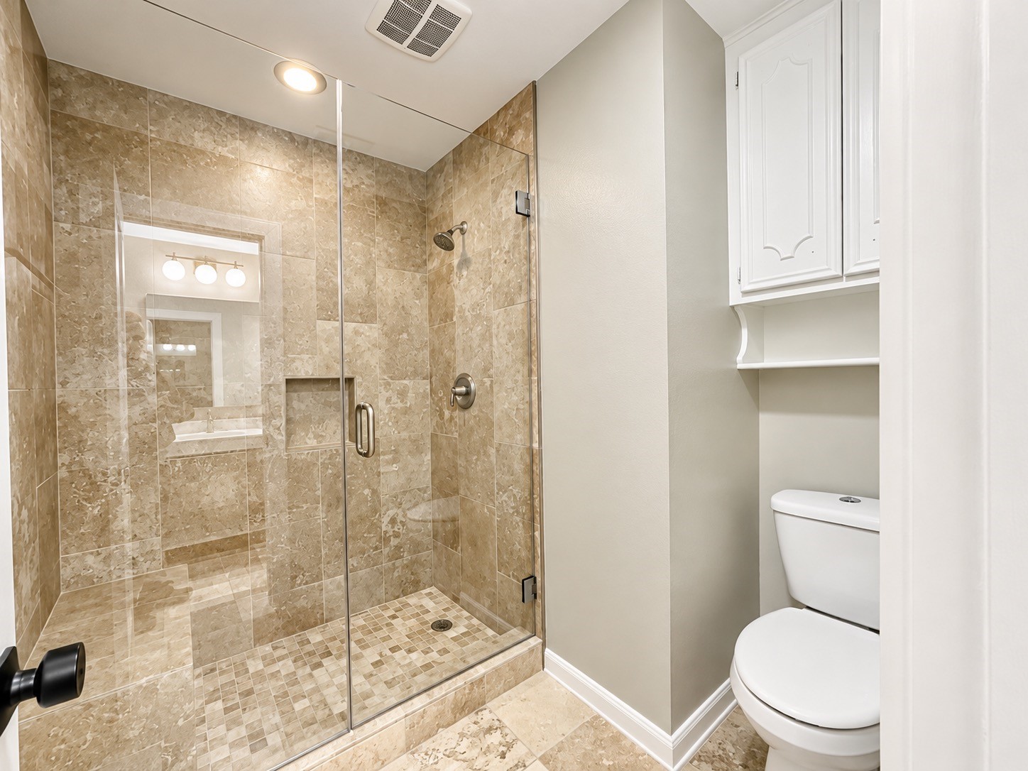 Stepping in to the wet area, you are greeted by the large shower protected by a frameless glass surround.