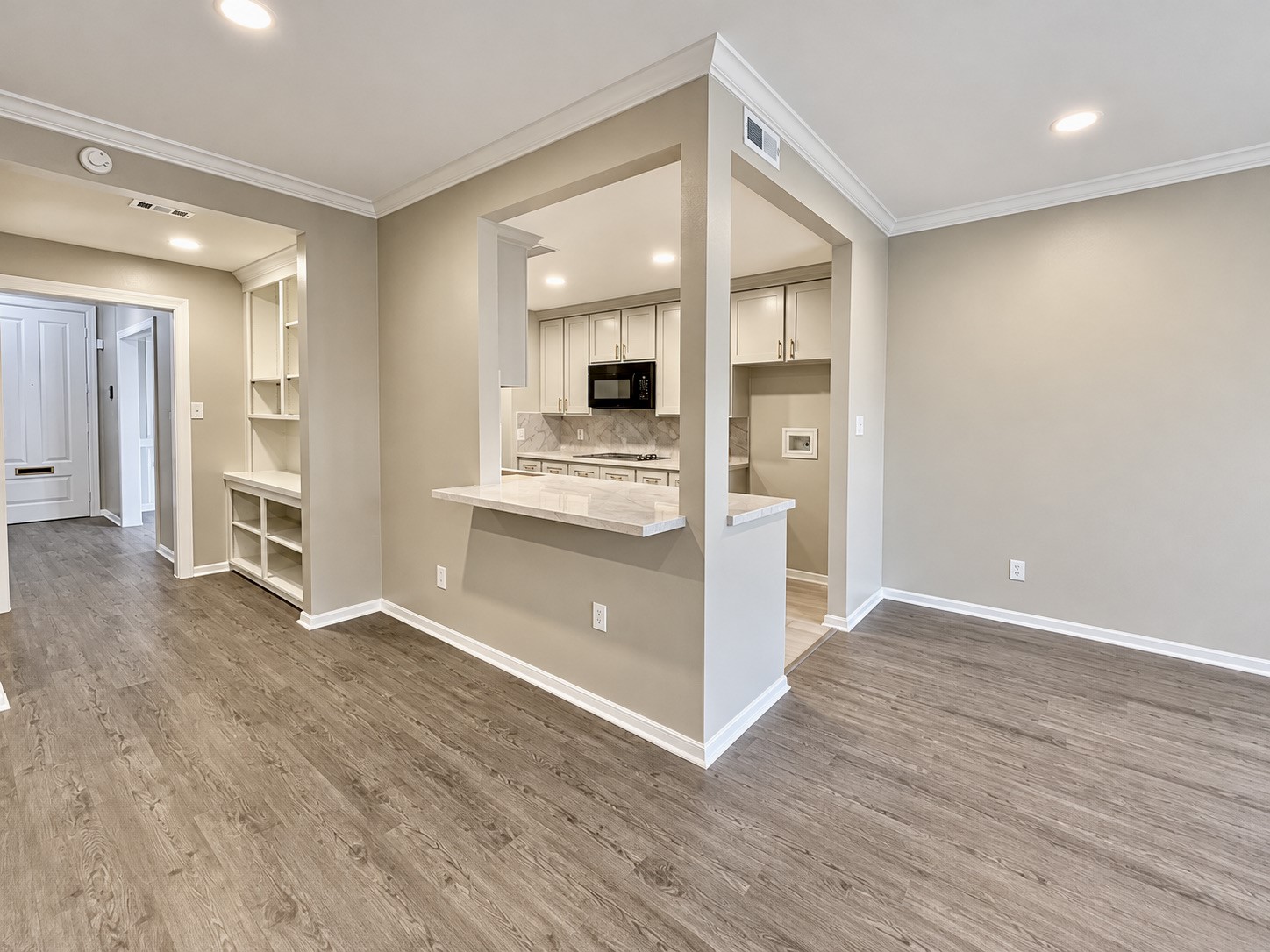 Taking a peak into the kitchen from the living room. You can see the coffee bar possibilities.